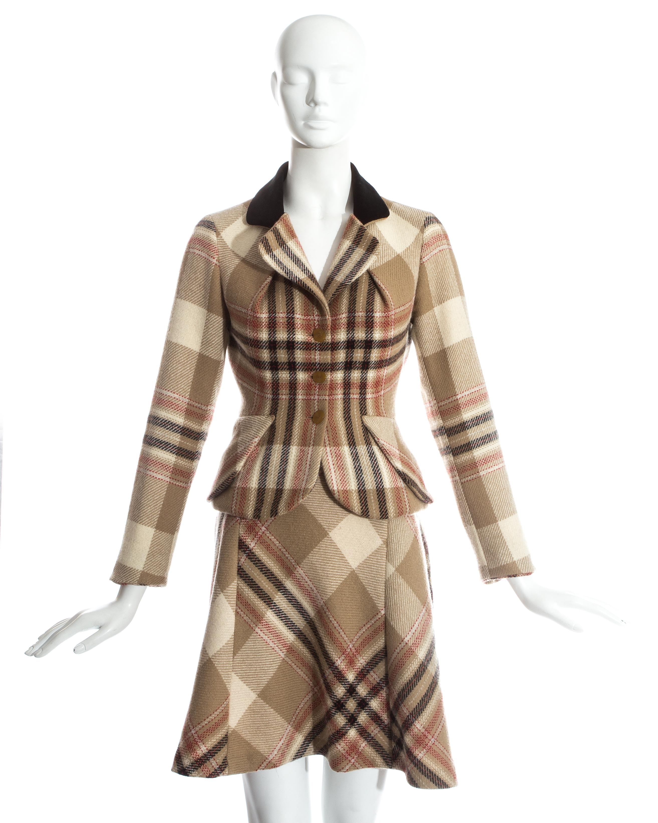 Vivienne Westwood tartan wool bustled skirt suit. Tailored blazer jacket with pleated bust, flap pockets and black velvet collar. Over the knee bustled skirt with gathering at the back.

c. 1993-1994