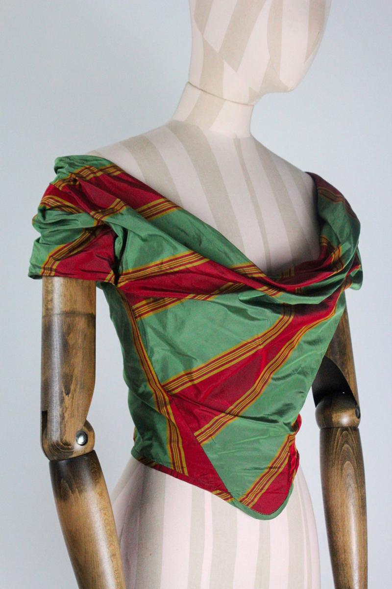 Vivienne Westwood couture Spring/Summer 1998 'Tied To The Mast' collection corset, in red and green striped silk. Draped neckline and internal boning.

Condition
Good. Some small marks on the right hand sleeve. White mark on one side, when worn this