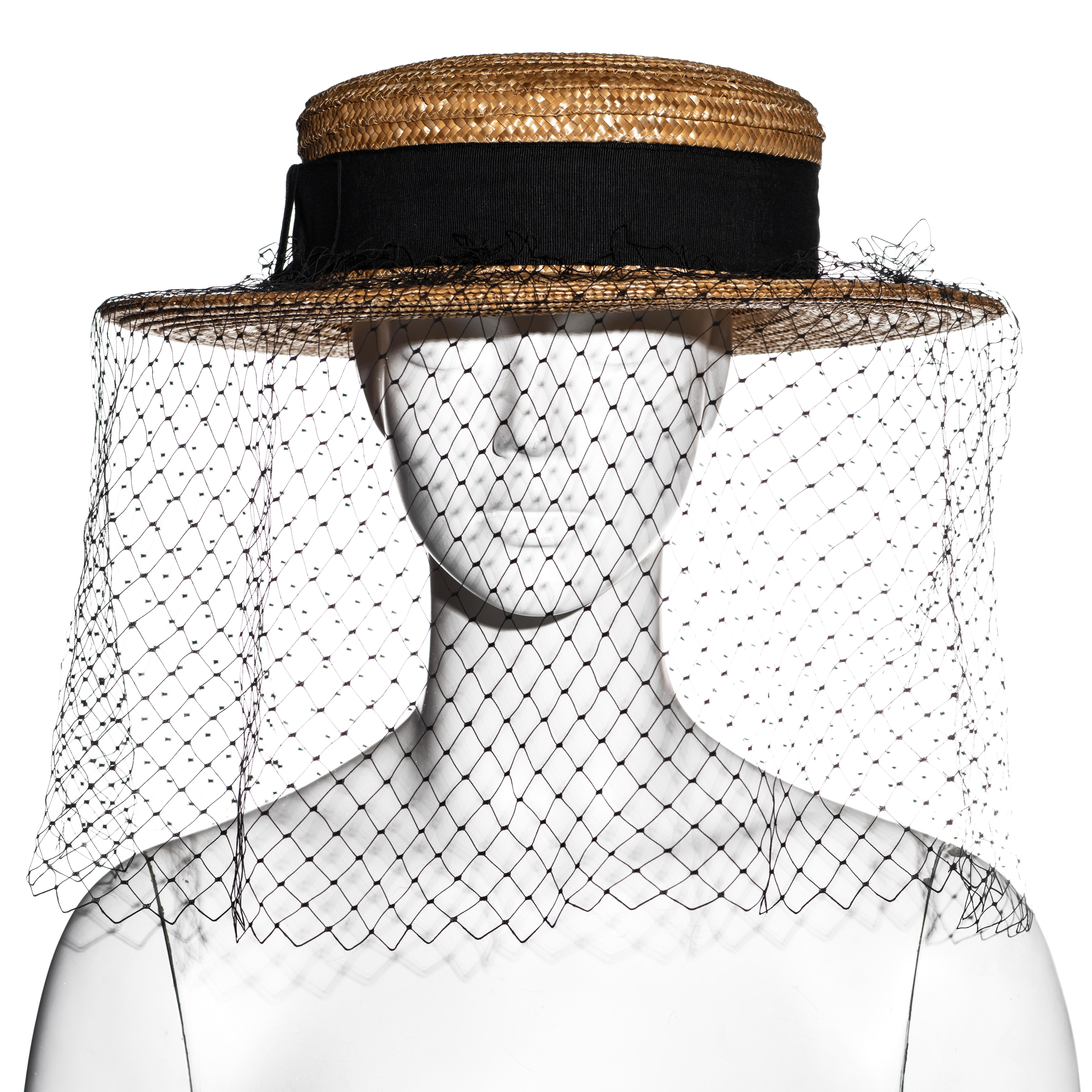 ▪ Vivienne Westwood raffia boater hat 
▪ Black grosgrain ribbon with bow
▪ Black fishnet veil 
▪ Size Medium
▪ Spring-Summer 1988