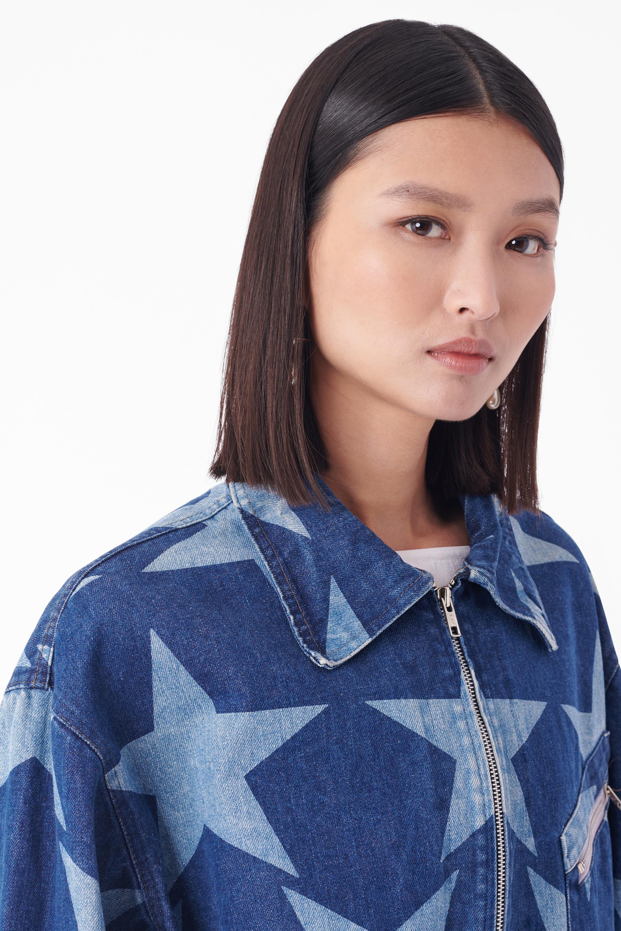 Vintage Vivienne Westwood Spring Summer 1985/86 denim jacket from the Mini Crini collection. As seen on the runway. Features iconic star print all over, two front pockets, front zip closure and collar. Star print as seen in the V&A and MET museum.