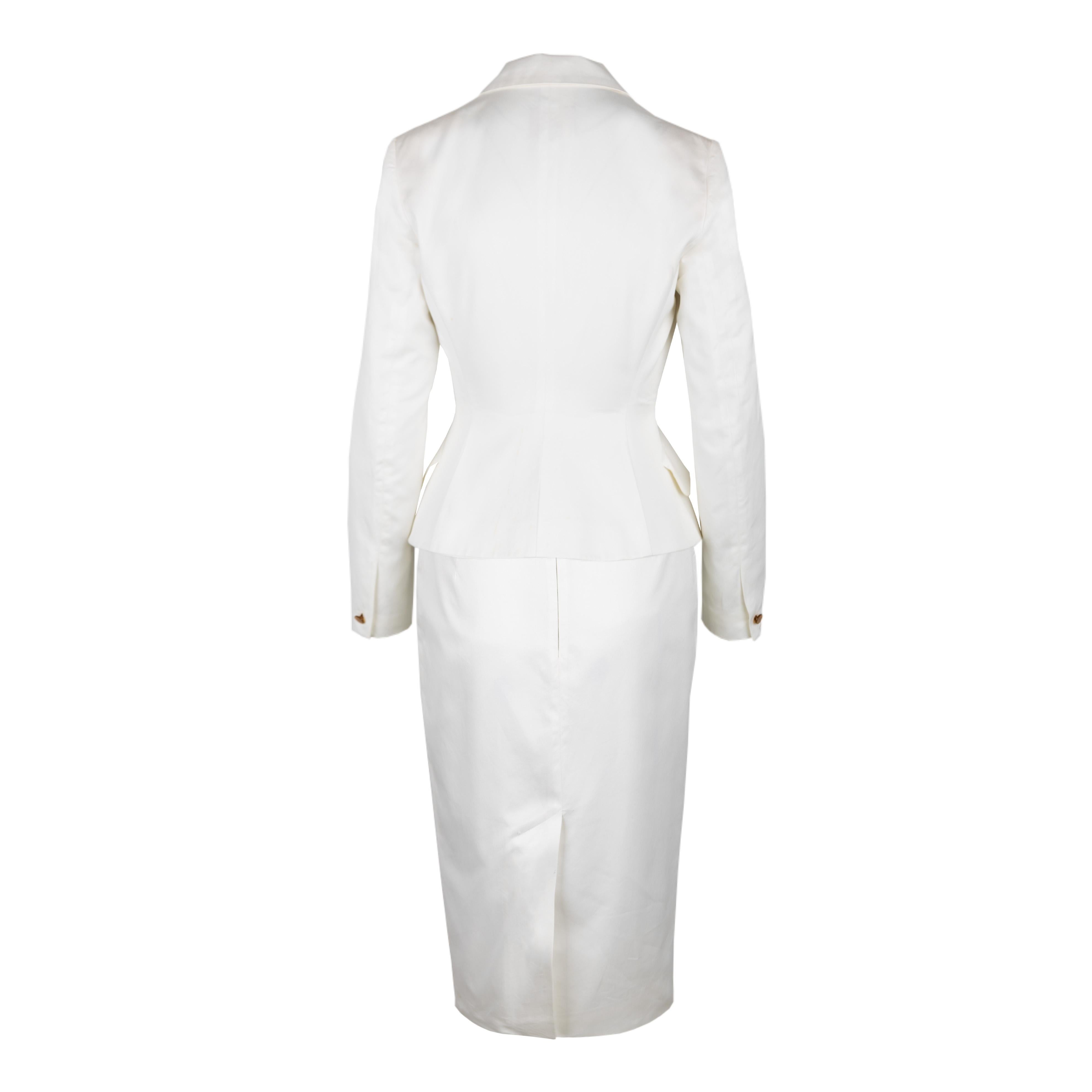 Vivienne Westwood red label skirt and jacket set in white, featuring a cinched waist that adds a flattering shape to the silhouette. The jacket has two logo embossed buttons and two front pockets that are sewn into the garment. The skirt has a short