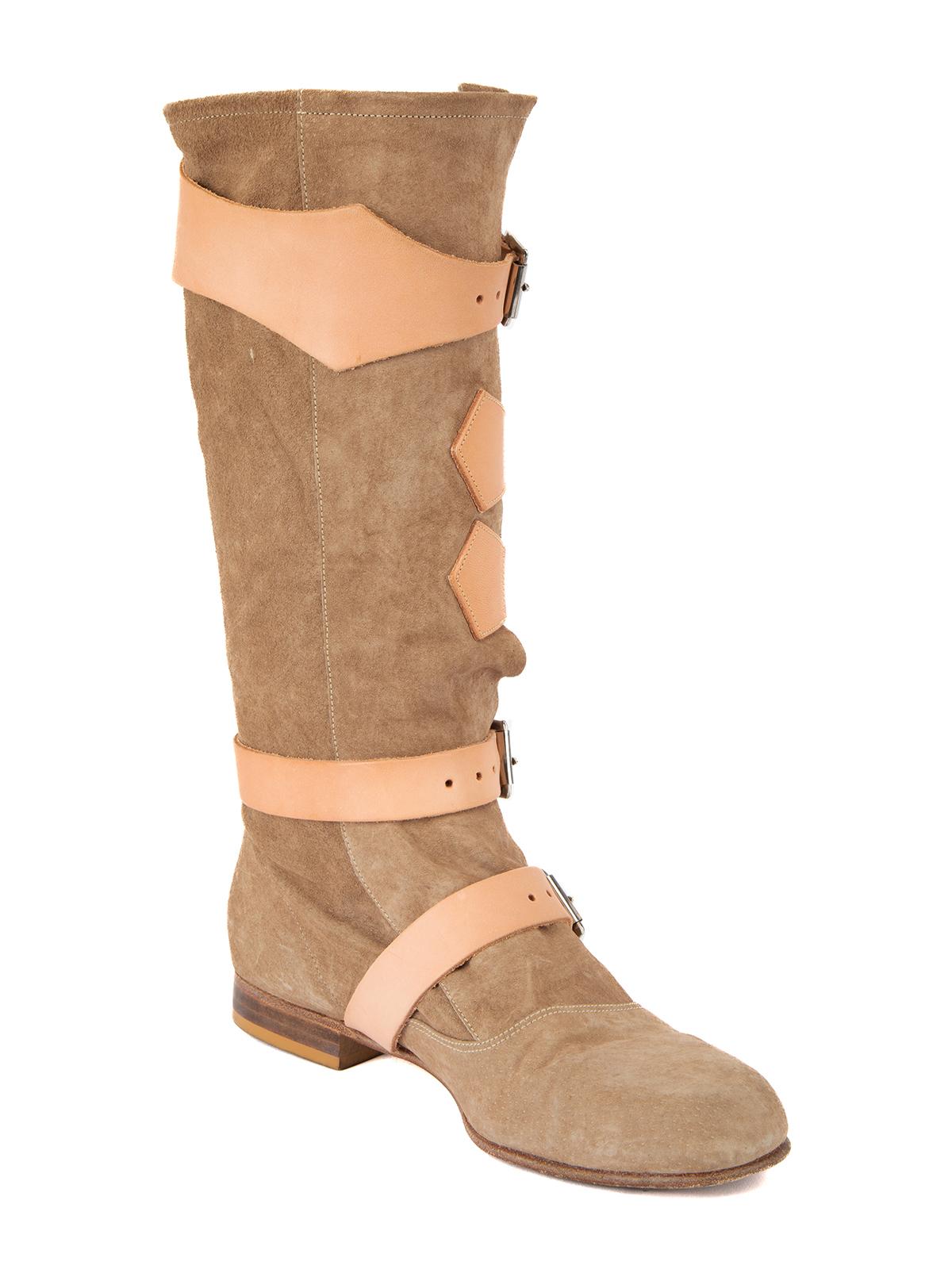 CONDITION is Good. General wear to boots is evident. Moderate signs of wear to the the outsole and suede exterior where scuffs can be seen on this used Vivienne Westwood designer resale item.   Details  Brown Suede Knee high Round toe Buckle details