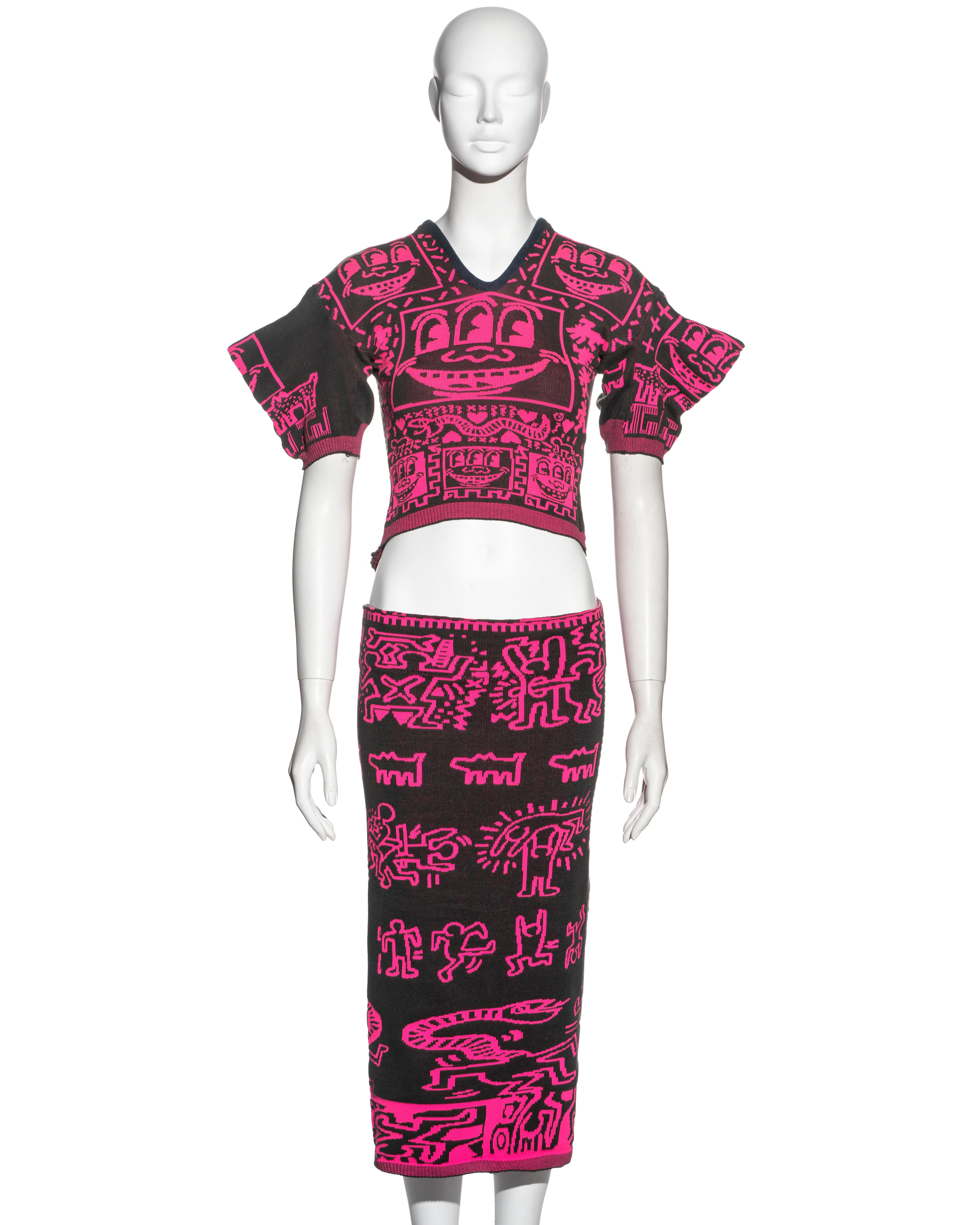 ▪ Worlds End by Vivienne Westwood and Malcolm McLaren in collaboration with Keith Haring 
▪ Sold by One of a Kind Archive
▪ Constructed from knit jersey in neon pink and dark grey
▪ Keith Haring woven imagery of smiley faces, figures, dogs and