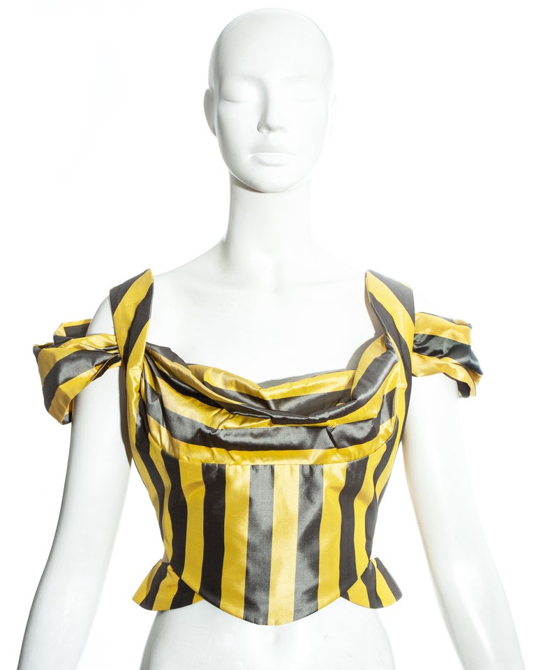 Vivienne Westwood yellow and white striped silk off-shoulder corset with draped neckline and orb button fastenings at the back. Built in corset designed to cinch the waist and push the breasts up.

Spring-Summer 1998