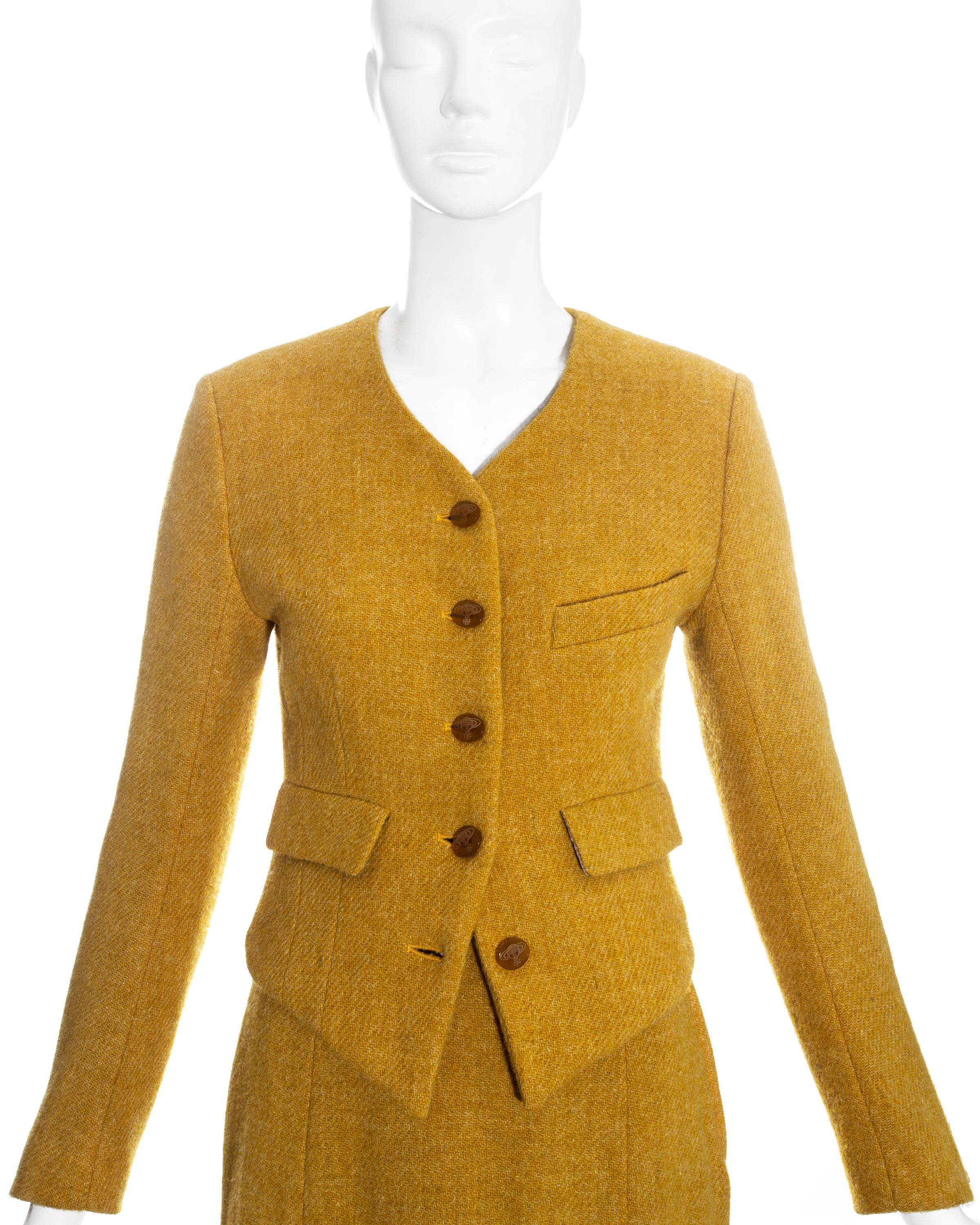 Mustard yellow wool knee-length skirt suit by Vivienne Westwood

Fall-winter 1994