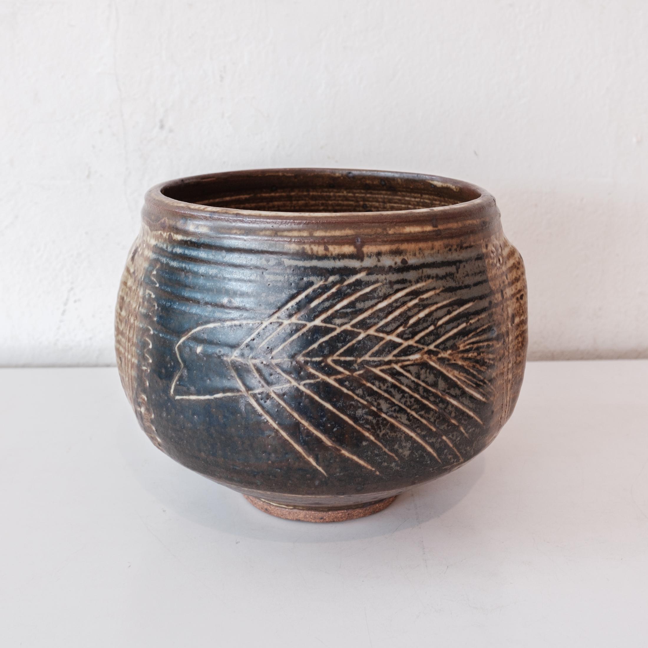 Vivika and Otto Heino stoneware bowl. Decorated with a great incised abstract fish design in cobalt and iron oxide glazes. There are also pushed out ridges on both sides, making this a really dynamic piece. It was purchased from the estate of a