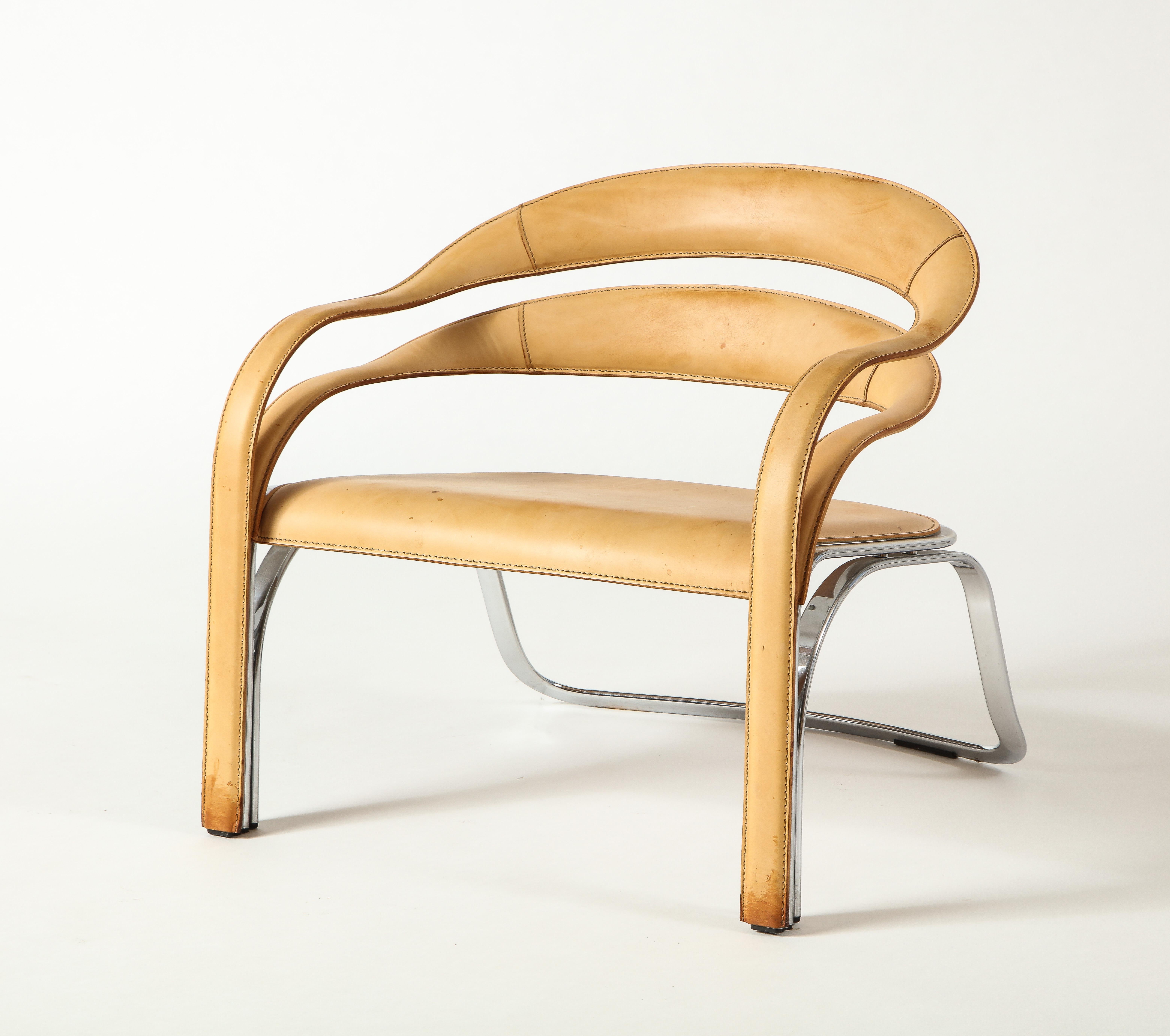 The kinetic lines of the Fettucini Chair fold together and gracefully join along the legs, drawing the eye across each contour. The floating backrest flows into twisting curves of the arms, with a precision reflecting the rigorous intention in