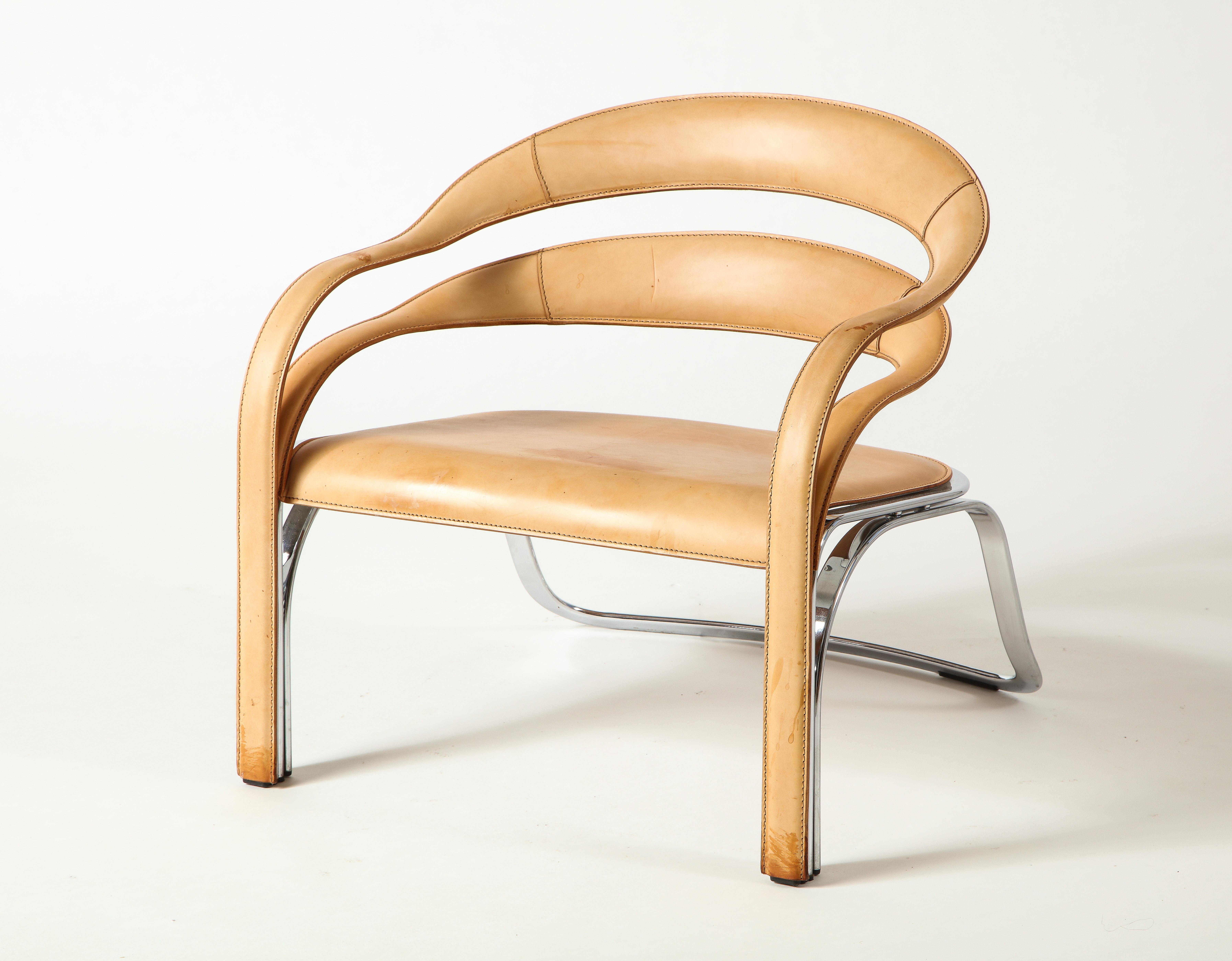 The kinetic lines of the Fettucini Chair fold together and gracefully join along the legs, drawing the eye across each contour.The floating backrest flows into twisting curves of the arms, with a precision reflecting the rigorous intention in