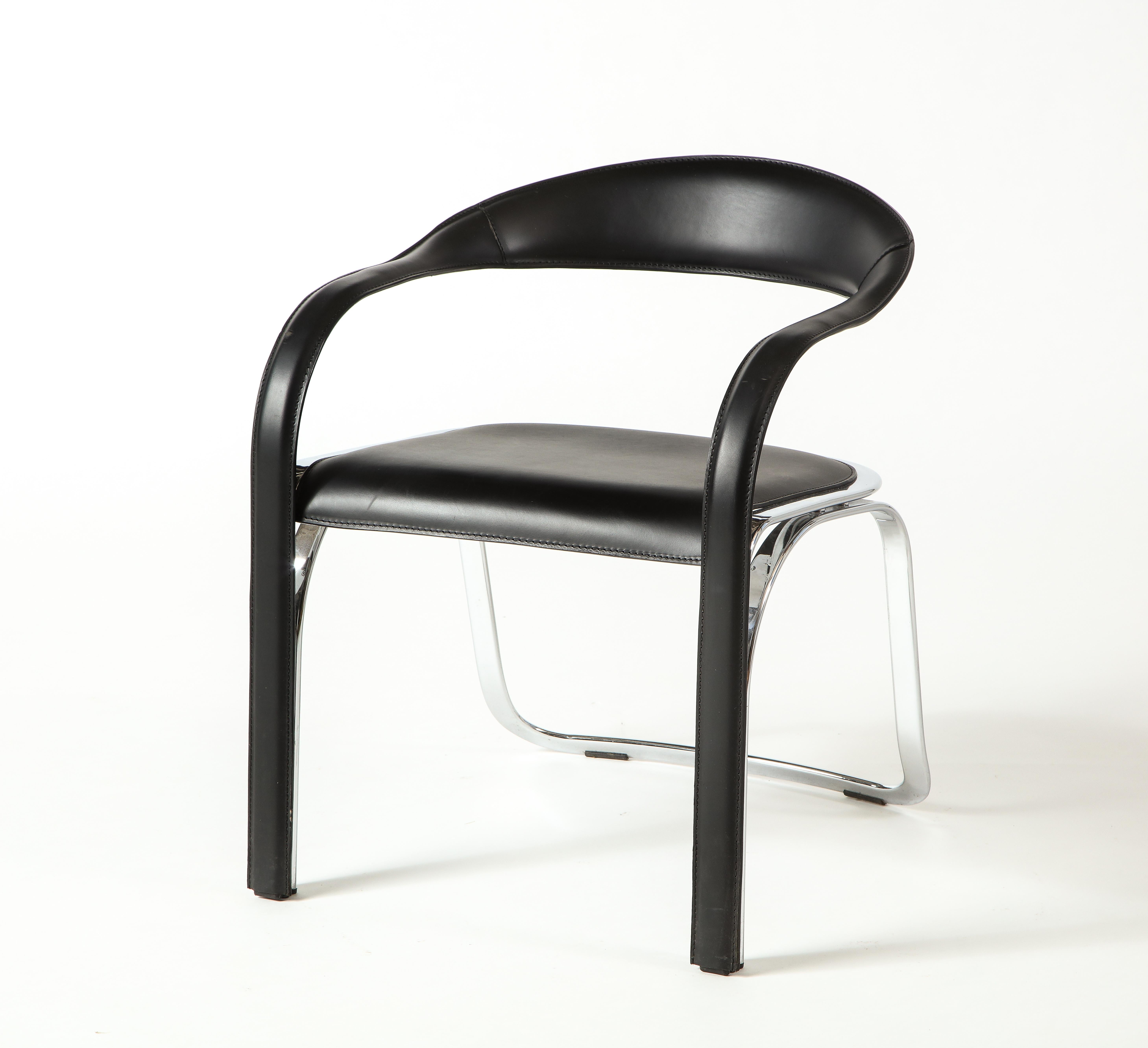 The kinetic lines of the Fettucini Chair fold together and gracefully join along the legs, drawing the eye across each contour.The floating backrest flows into twisting curves of the arms, with a precision reflecting the rigorous intention in