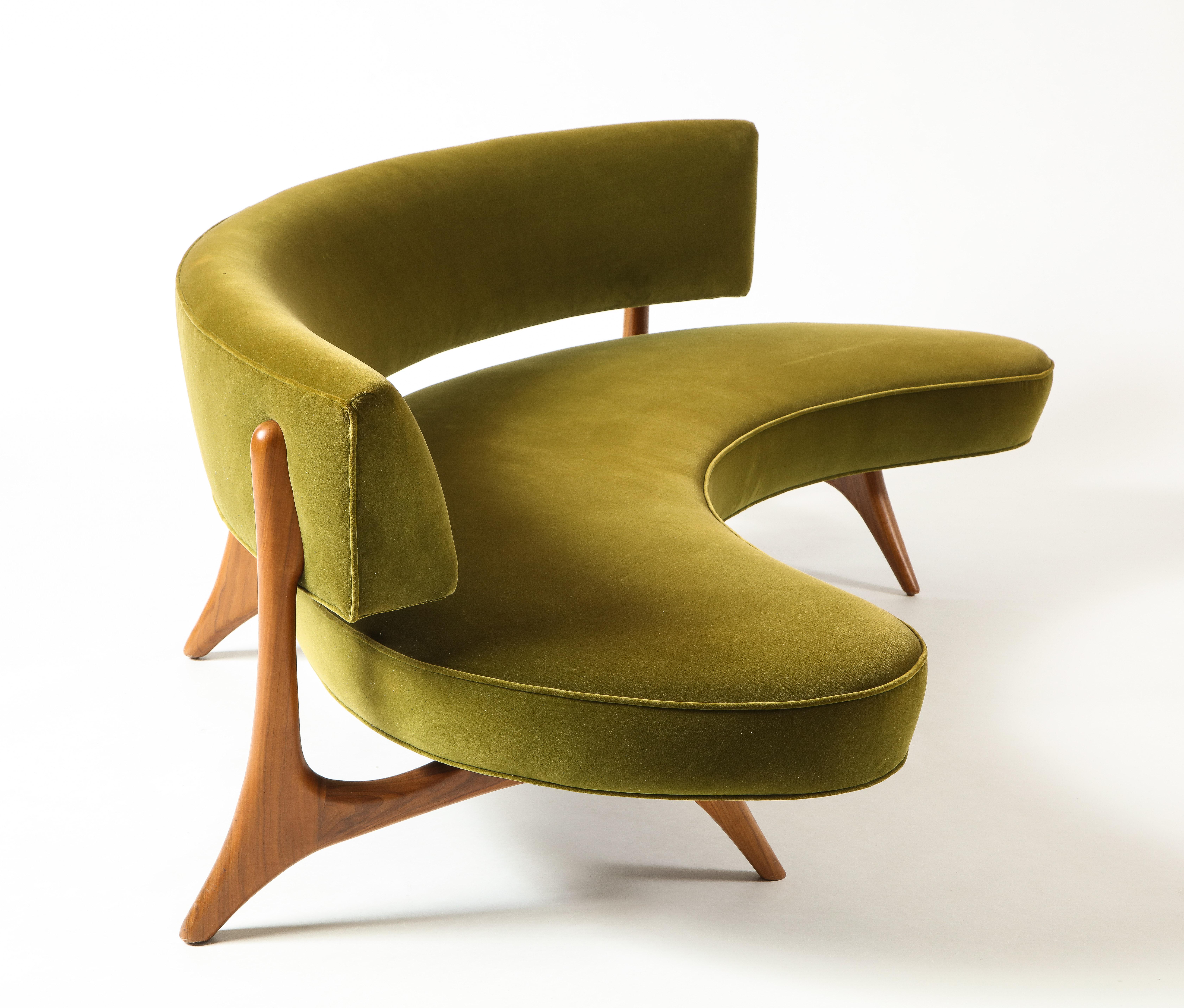 First designed in 1952, the Floating Curved Sofa united two early Kagan signatures with its curved shape and elegantly sculpted Walnut frame. The floating backest invites placement away from the walls, with negative spaces that allow glimpses of