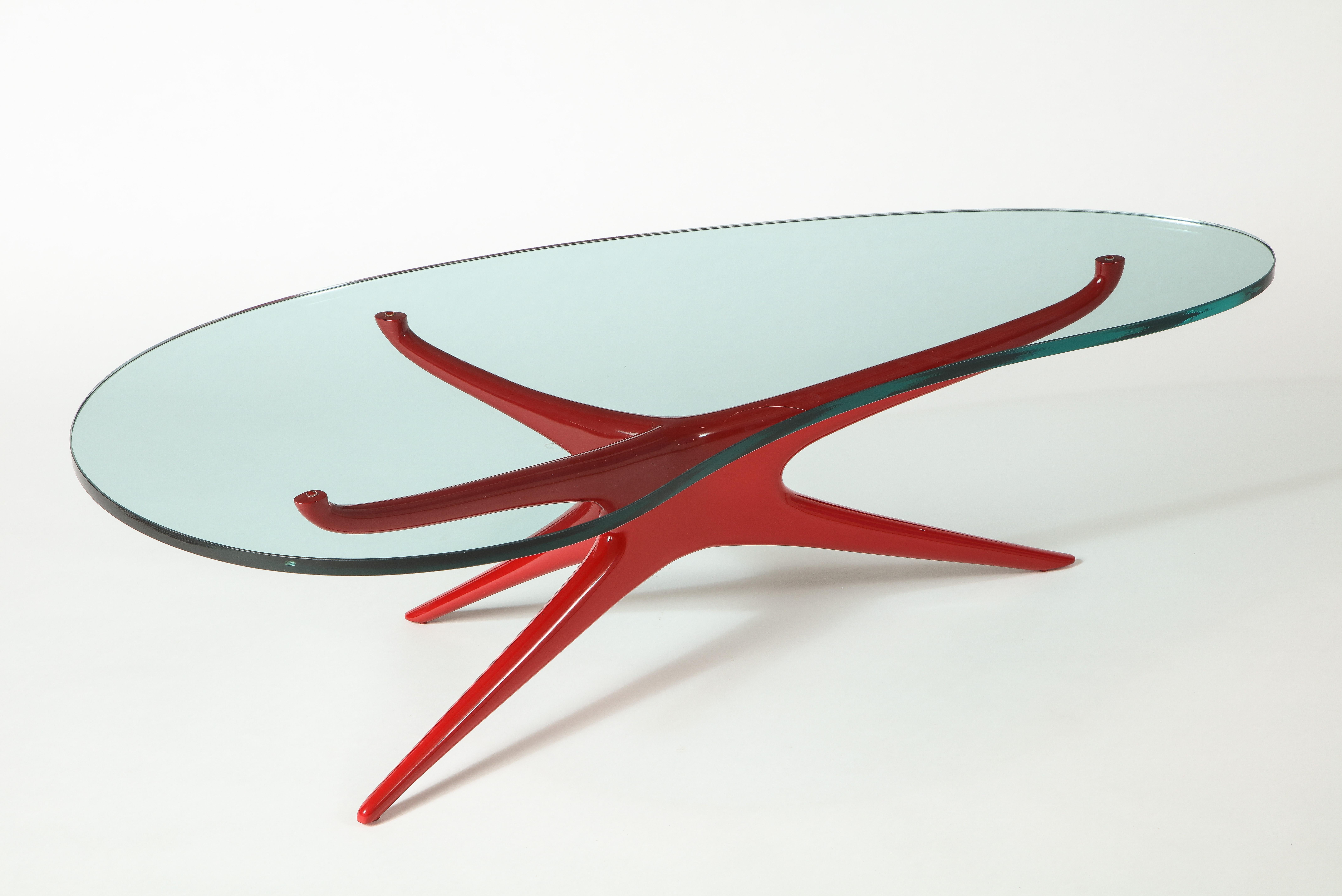 Recognized early on as an icon among Vladimir’s repertoire, the 412 Sculpted Coffee Table has become a hallmark of midcentury modern design. Sinuous sculpted base draws the eye sharply upward into a dynamic joint that grows organically out to