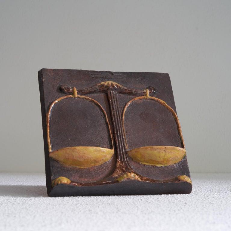 VladimÃ­r David for Jihokera Bechyne Zodiac Tile Scales / Libra. Czech Republic, mid 20th century.     This is a great mid-century studio pottery tile depicting the Zodiac sign of the Scale / Libra. It was made by the pottery workshop Johokera from