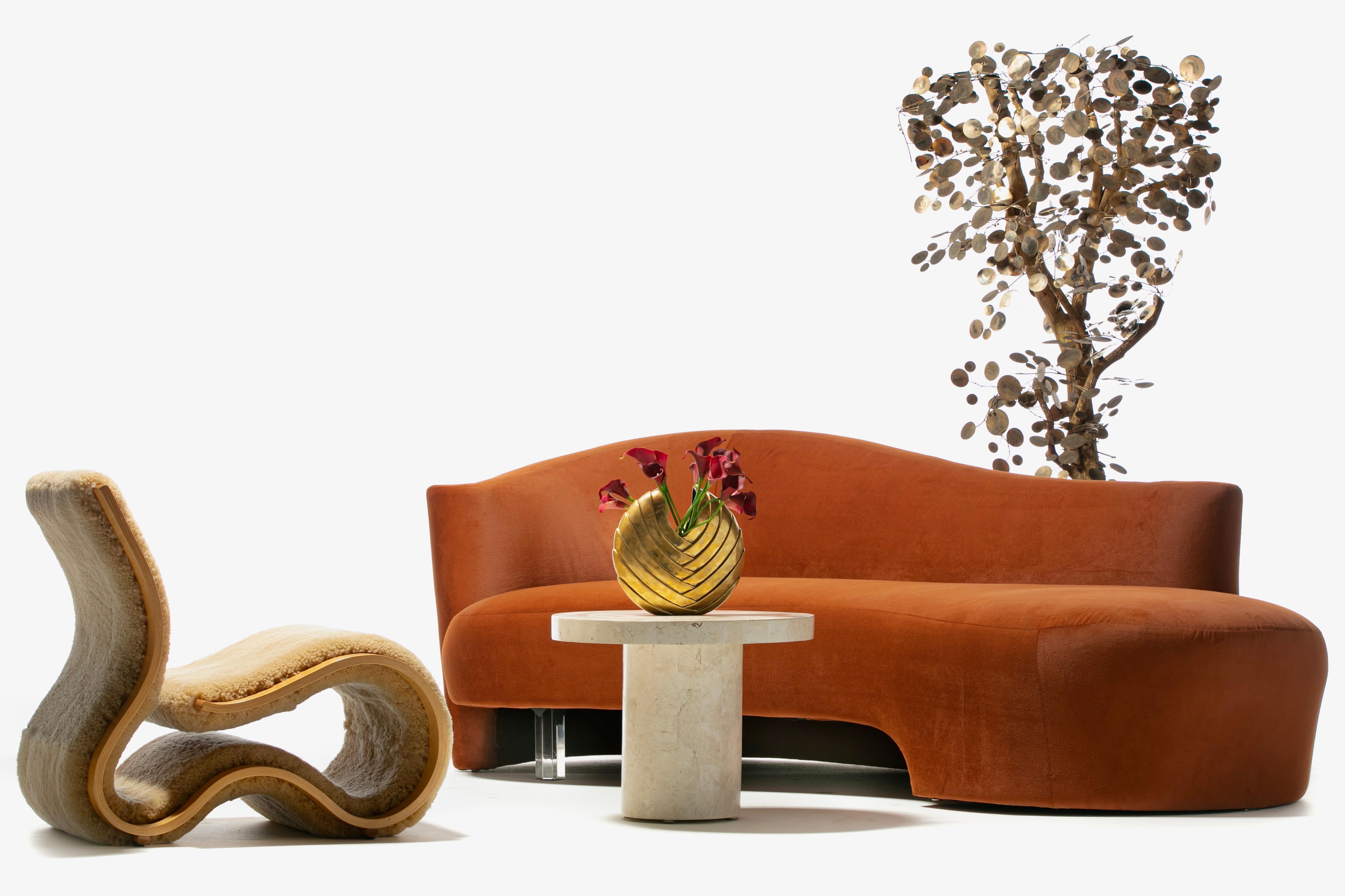 There's not a single straight line in this sexy Post Modern Serpentine Sofa upholstered in a rich terracotta velvet and made by Weiman. The look is Modern. High Art. Uber Sexy. Amorphous to the max, the silhouette curves from every angle. Unlike