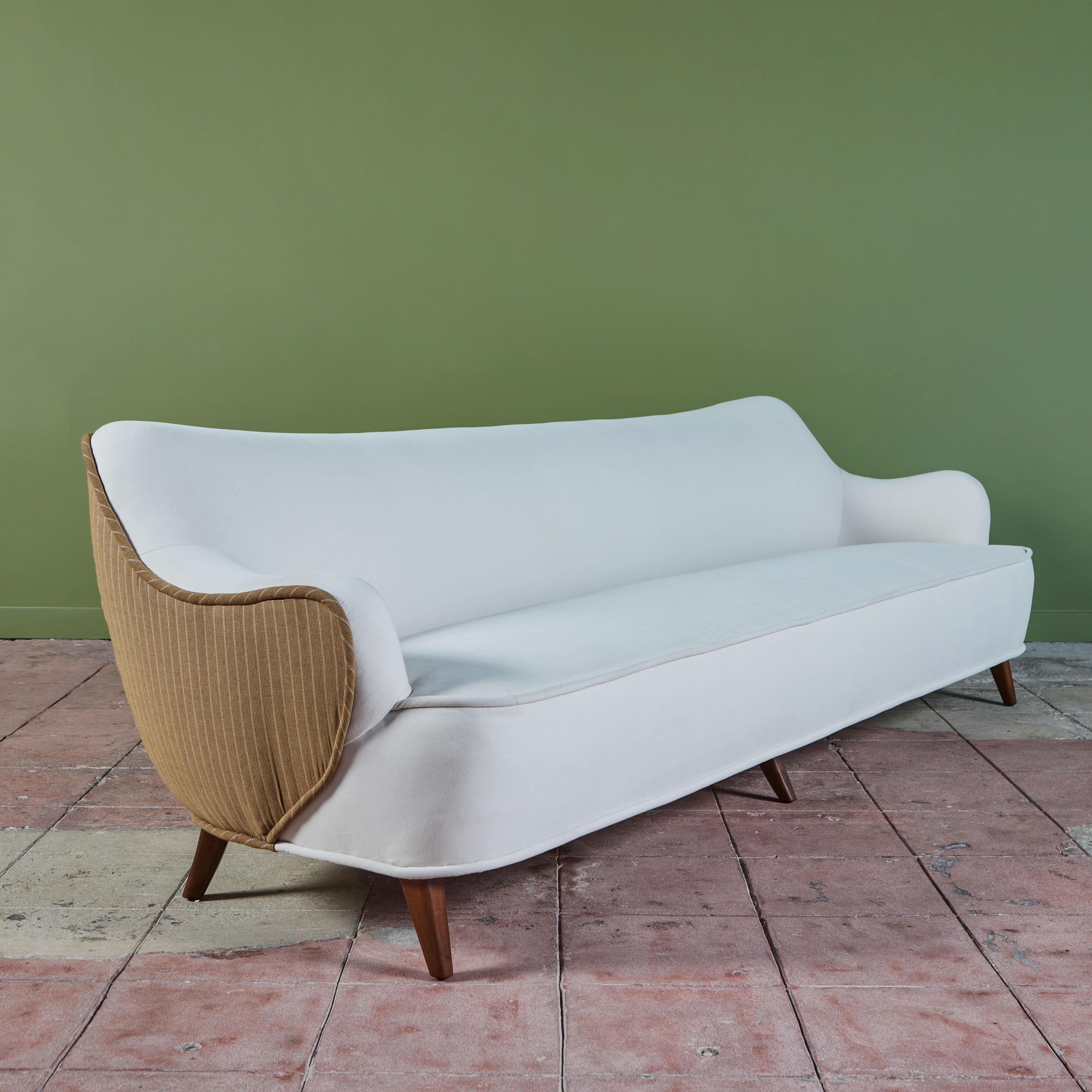 Long Barrel Back sofa by Vladimir Kagan for Kagan-Dreyfuss, c.1950s, USA. We're happy to present this piece in collaboration with Armando Aguirre of Studio Armando Aguirre. Armando, who advised on upholstery, was inspired by the organic forms of