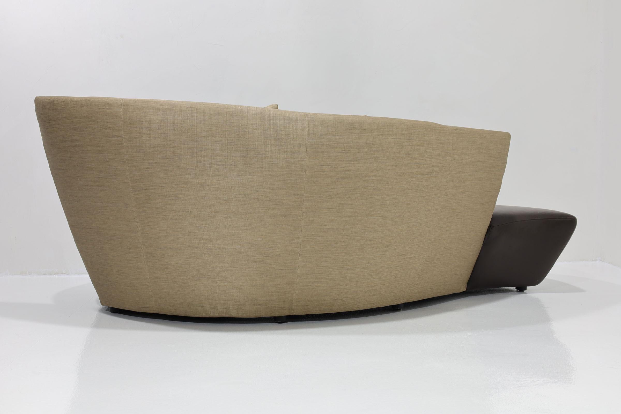 A Post Modern  Vladimir Kagan Bilbao sofa upholstered in silk and leather circa 1990s. Enamored with Bilbao, Spain, the Bilbao chair is a manifestation of Vladimir Kagan's impressions from his time spent on holiday. He was especially inspired by the