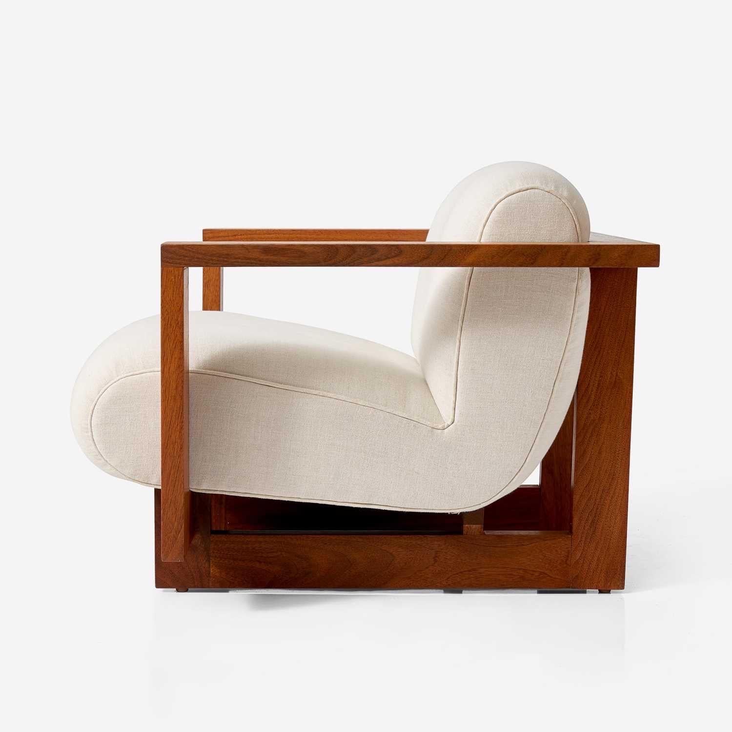 A wonderful child's cubist club chair that was commissioned by Angelina Jolie as a gift for her children, reflecting Brad Pitt's interest in contemporary American design. Sophisticated and playful constructed of walnut and fabric