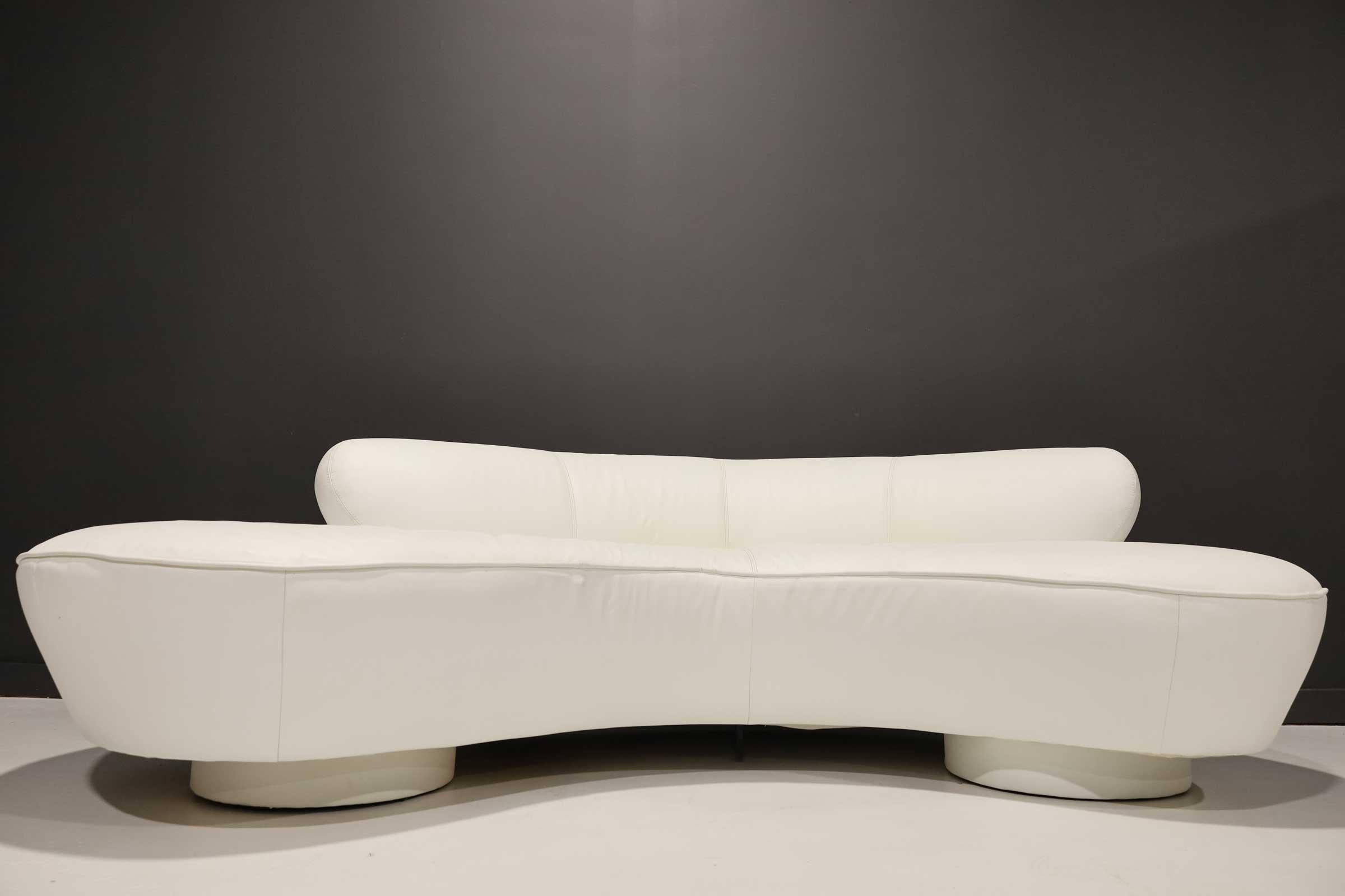 Vladimir Kagan's iconic cloud serpentine sofa by Directional. This sofa is upholstered in white leather. We have another Kagan cloud if you wanted a pair of opposing sofas. They would both need to be reupholstered to match.