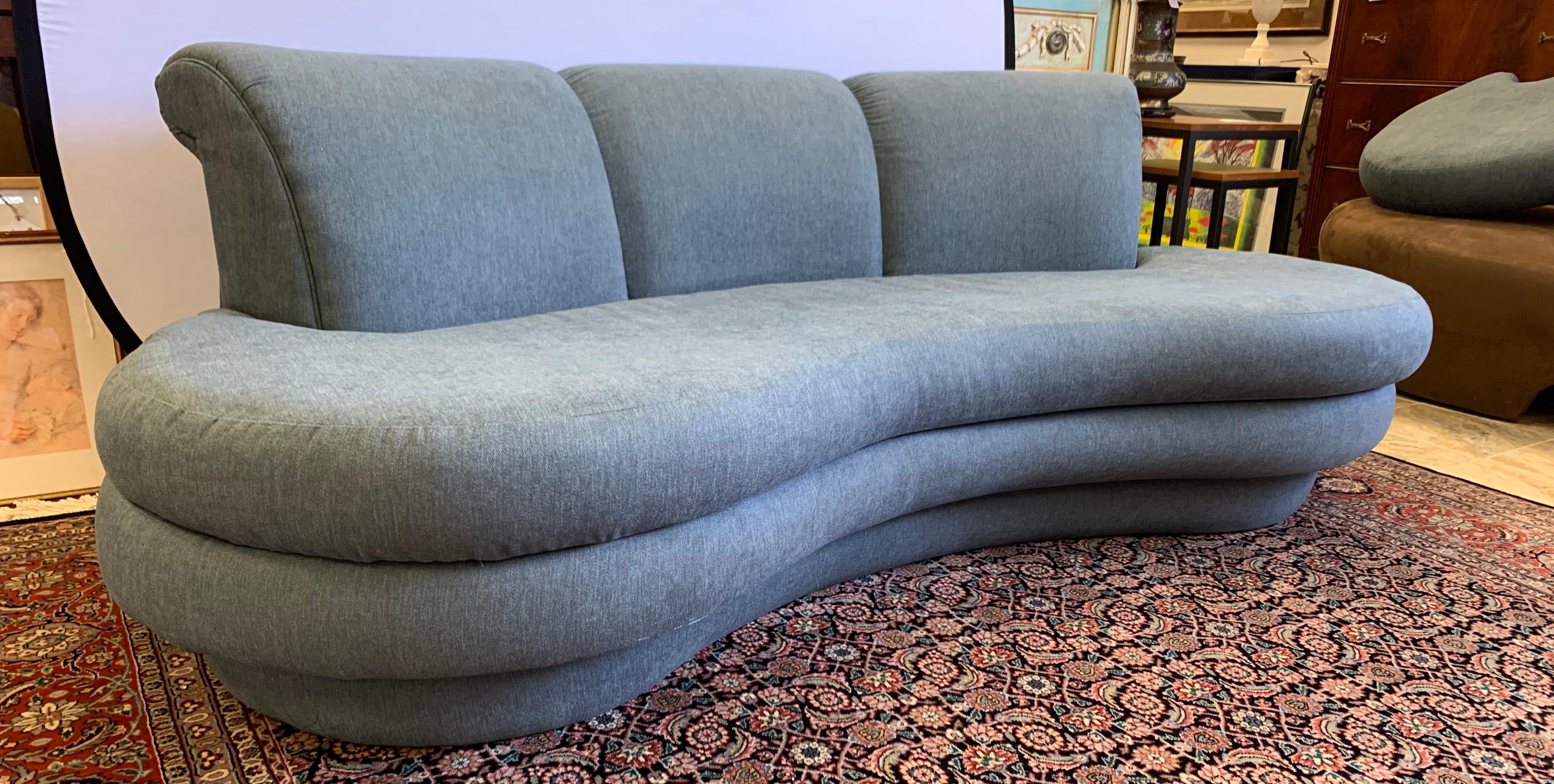 Newly upholstered this week in a luxurious slate gray cotton blend fabric, this Pearsall seven foot sofa has the lines, scale and comfort that make it so coveted. It is one of two identical Pearsall sofas that
we are selling exclusively on 1stDibs