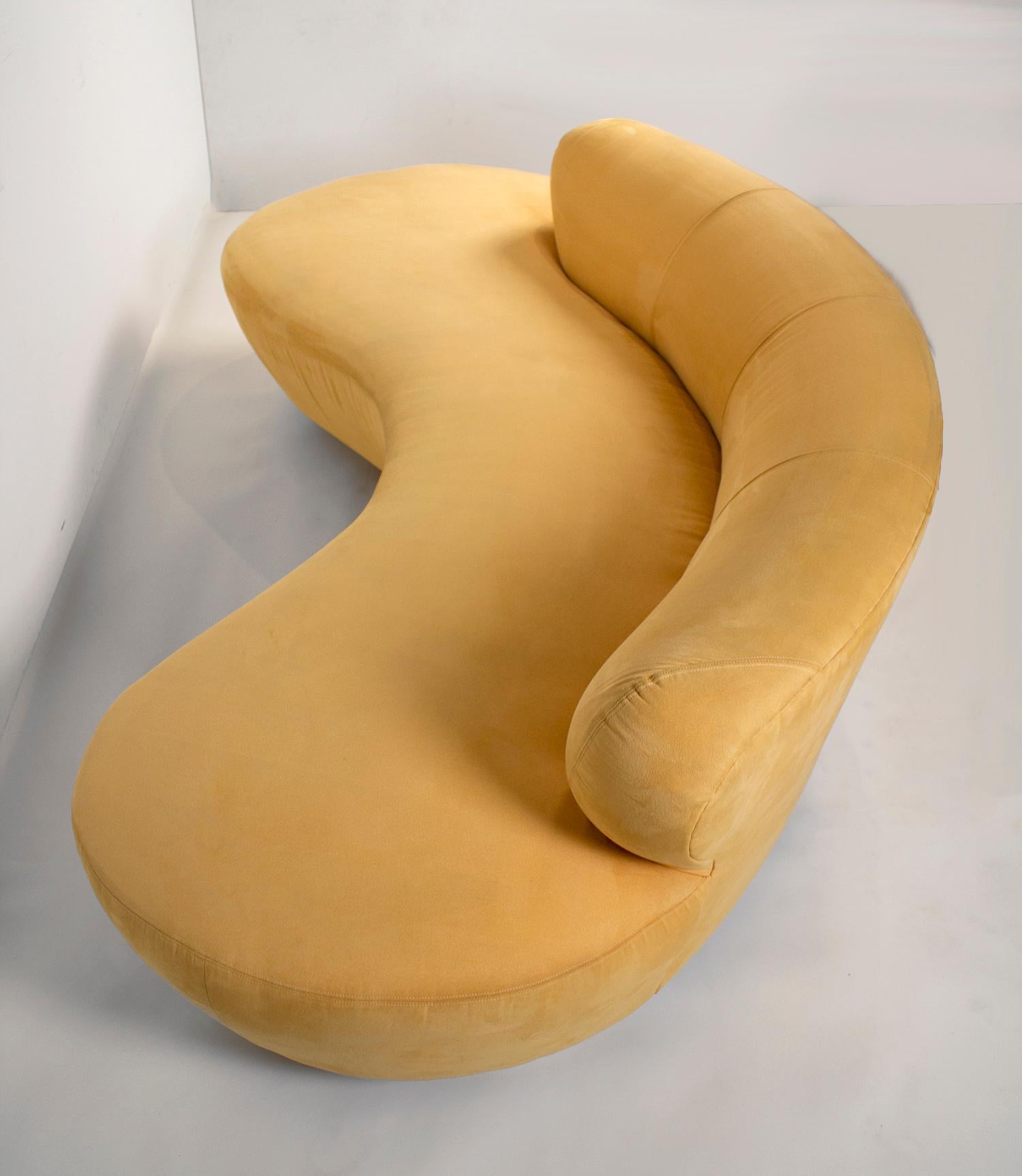 Vintage Vladimir Kagan crescent shaped cloud sofa produced for Directional with oak pedestals and acrylic center support.
The original label is still intact. The sofa retains its original buttercream Ultrasuede.