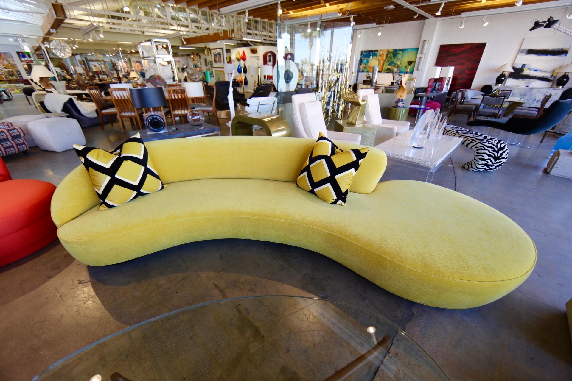 A Vladimir Kagan designed cloud sofa in a mustard yellow color. It was purchased a few years ago from Holly Hunt. In very good condition with some minor marks and imperfections.