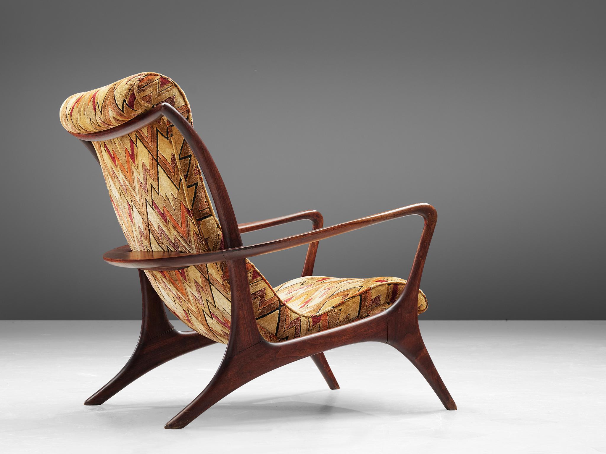 Vladimir Kagan for Dreyfuss, 'Contour' high back chair, teak and fabric, United States, 1953

This lounge chair by Kagan is sculptural and delicate. The frame, executed in teak and carved in an exquisite manner. The hind legs are long and protrude