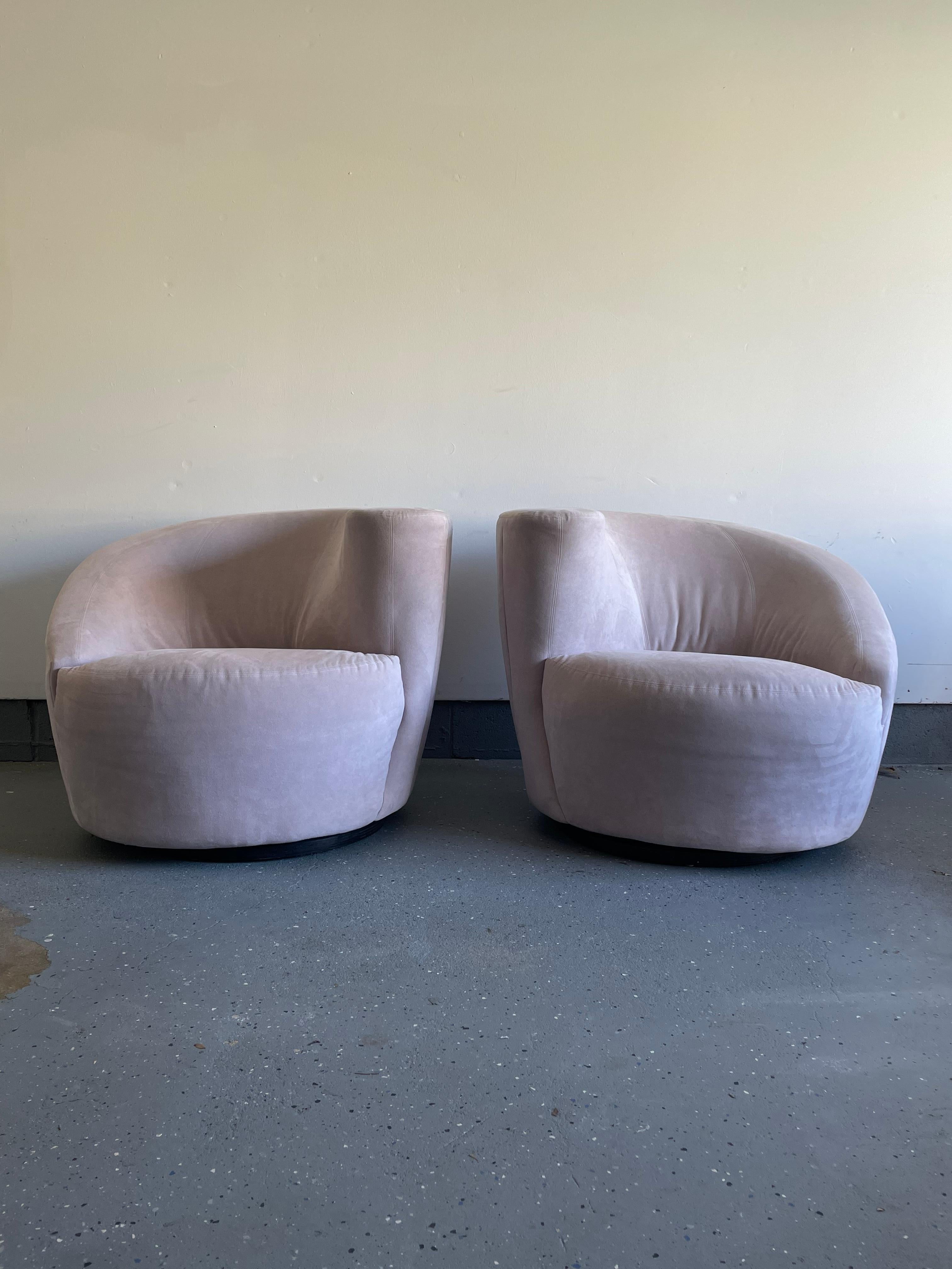 Chairs are currently upholstered in the original blush/ tan microsuede upholstery. Chairs feature an organic design of the back sloping down in a cork screw manner there by serving as the arm as well. Also regarded to as a Nautilus chair. 

Please
