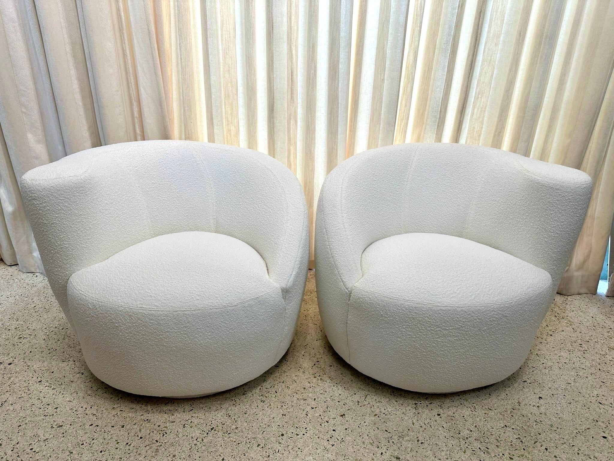 Newly reupholstered in a soft and nubby bouclé, these 'Corkscrew' swivel chairs, also often referred to as 'Nautilus', by Vladimir Kagan for Directional, circa 1980s / 90s. These classic Post-Modern club chairs swivel 180 degrees on a circular