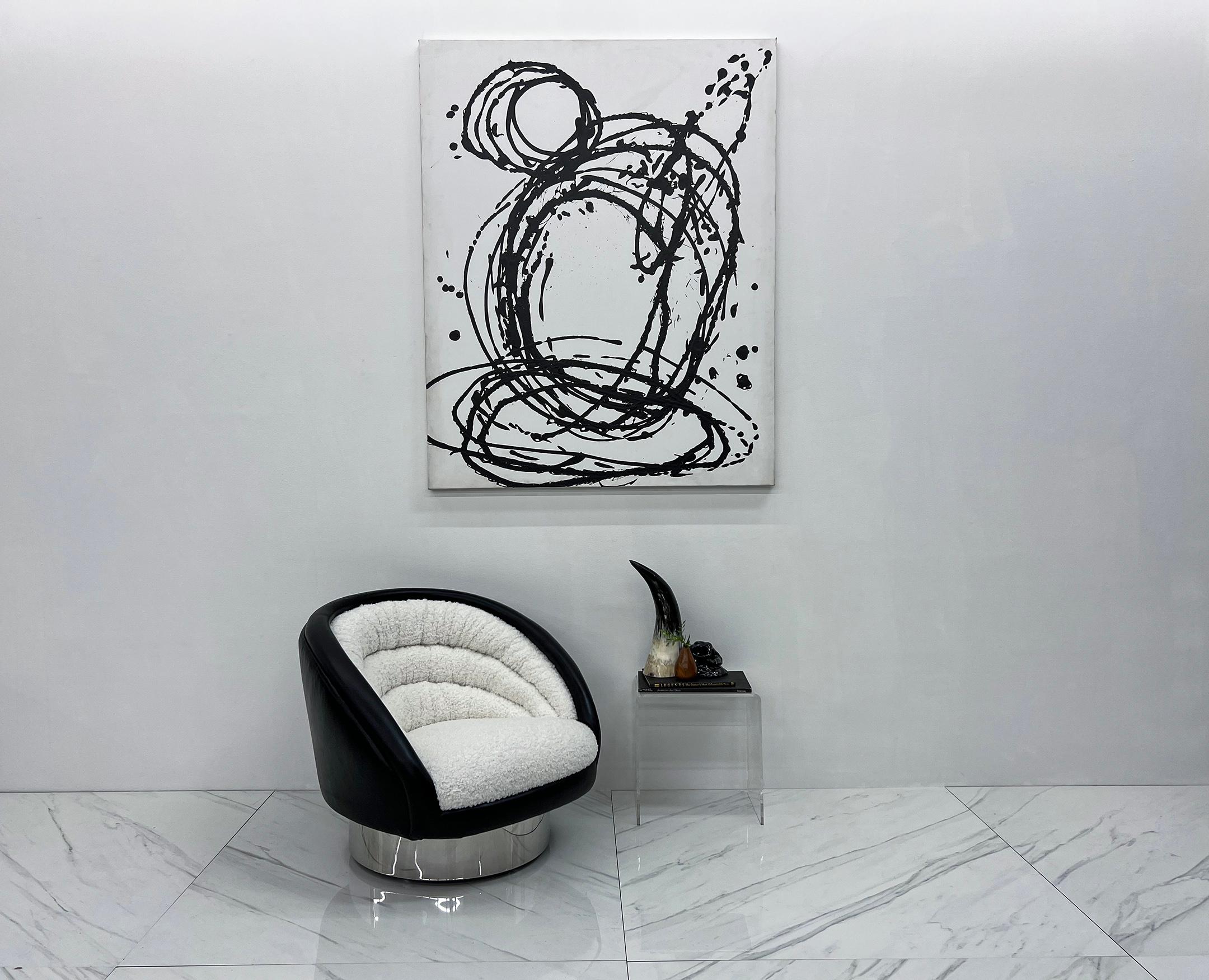 This chair is incredible. Designed by Vladimir Kagan for Vladimir Kagan Designs, this crescent chair is about as luxurious and beautiful as it gets. Completely overhauled and upholstered in a thick, high-pile, sherpa style boucle and wrapped in the