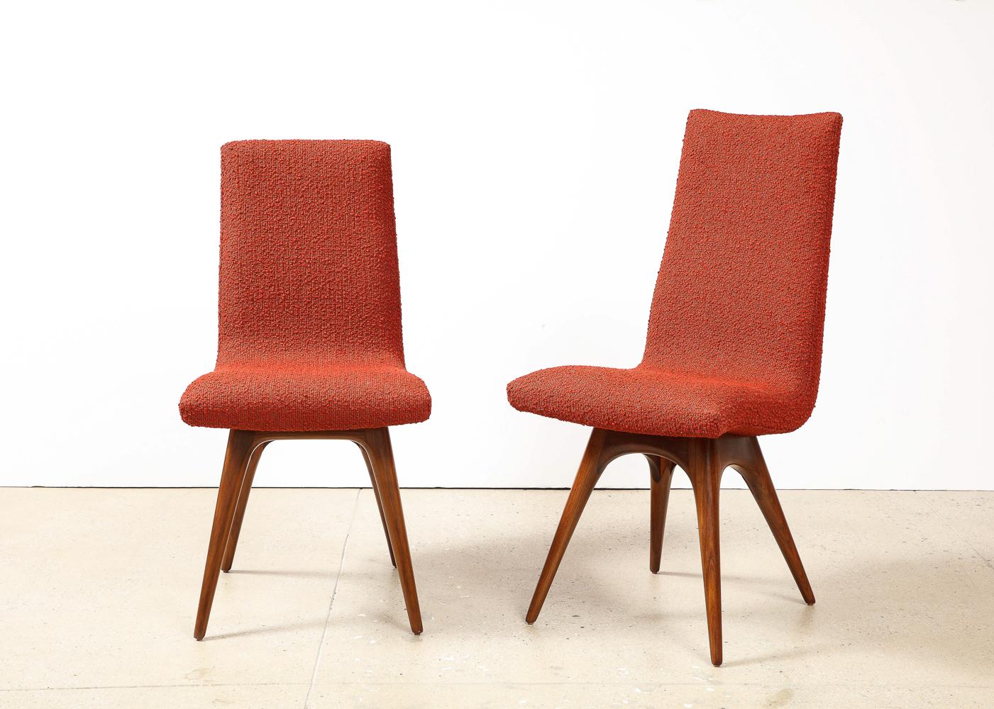Set of 8 Nexus Dining Chairs by Vladimir Kagan.  Walnut, upholstery. 8 armless chairs including 2 taller chairs & 6 lower side chairs. Beautifully sculpted walnut bases. Upholstered in rust-red boucle.

