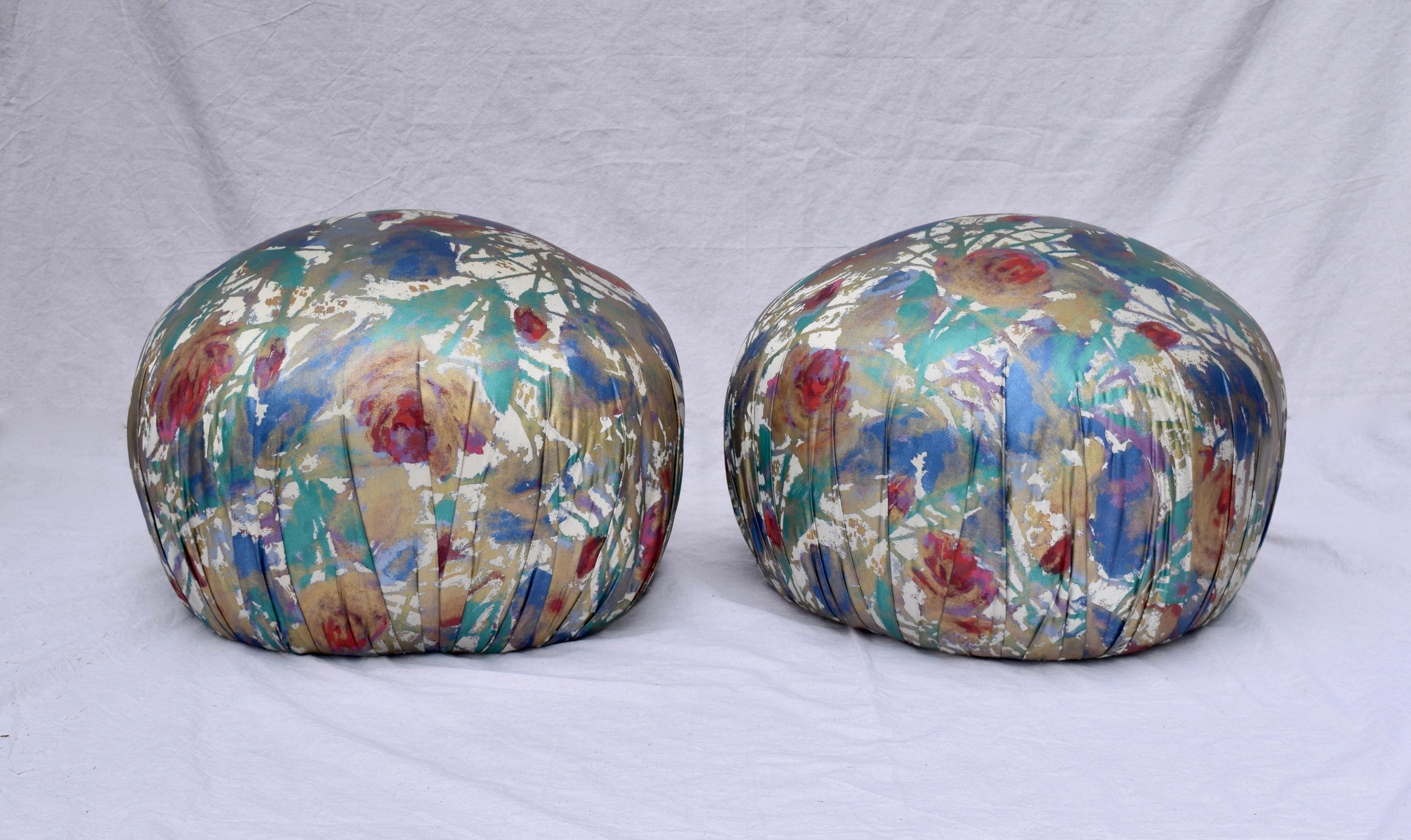 An exceptional pair of generously sized pouf ottomans designed by Directional. As if frozen in time, striking original shimmering hand painted fabric has been covered since the time of purchase in the early 1980s. Original Directional tags are