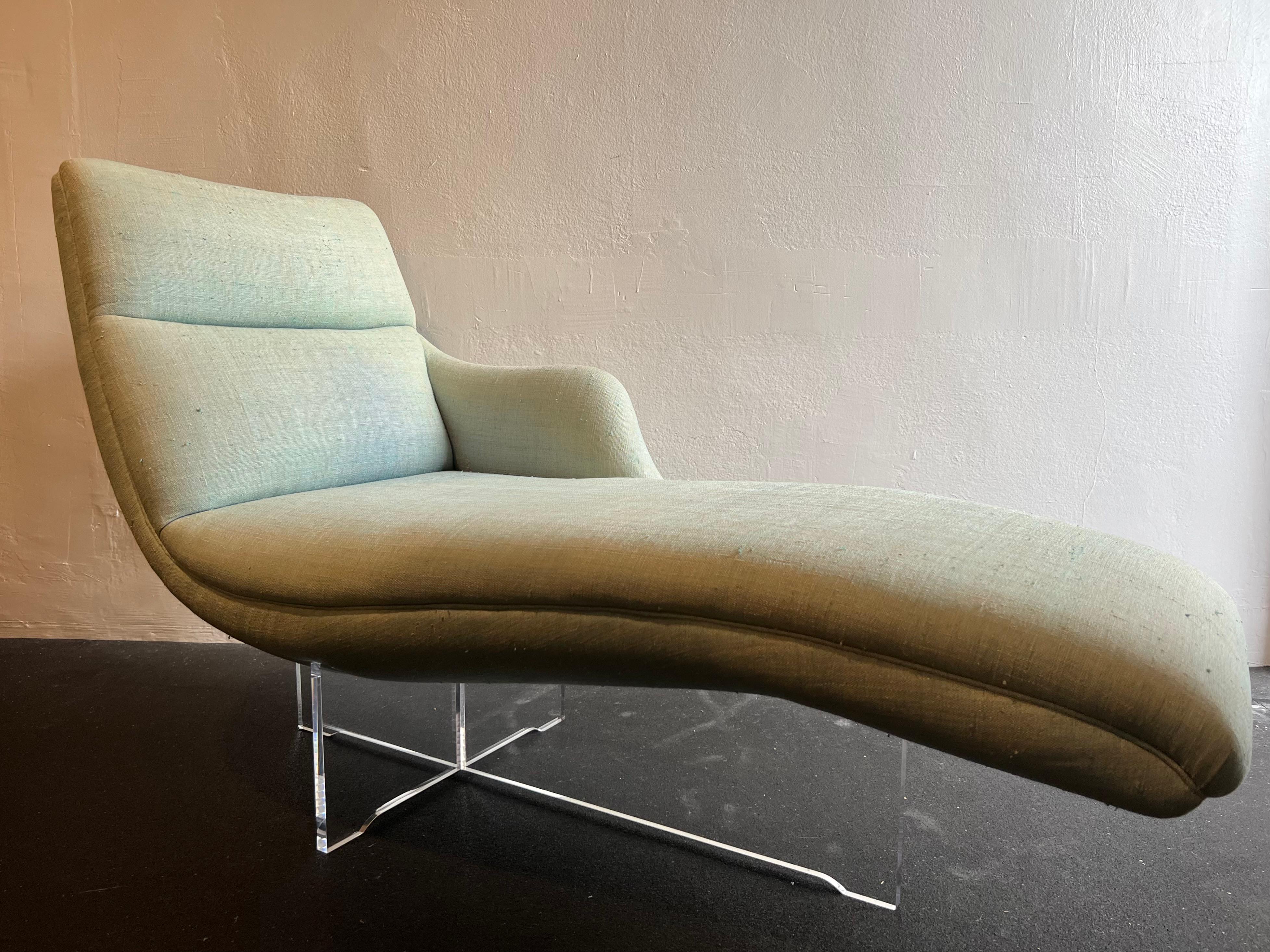 Iconic Vladimir Kagan Erica chaise lounge on lucite base. Although there are no rips or tears in the original upholstery, reupholstery is highly recommended (please refer to photos). The lucite is in excellent vintage condition. Additional photos