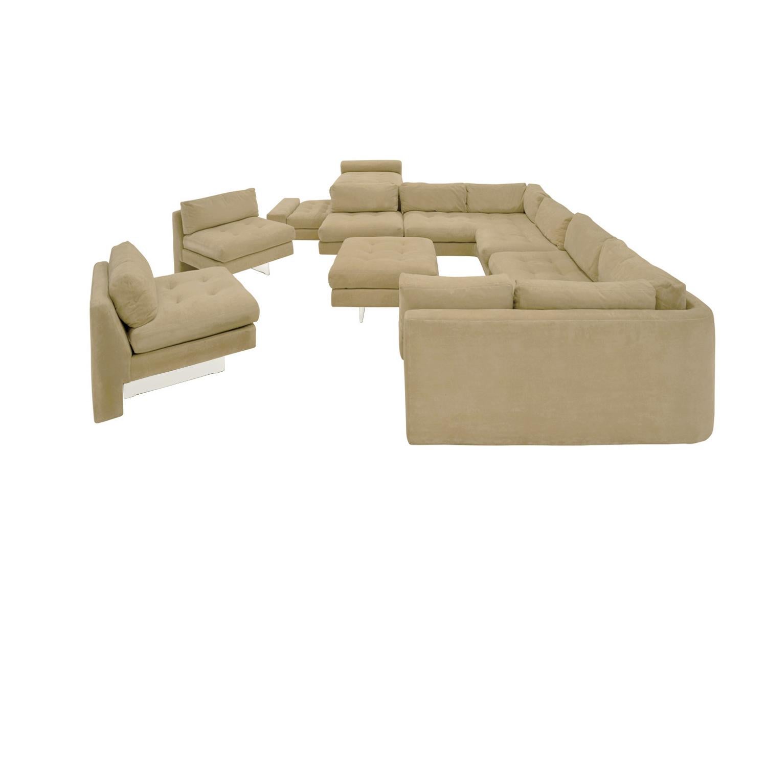 Large sectional sofa, upholstered with Lucite bases, by Vladimir Kagan, Omnibus Collection, American 1975 (signed with original labels). This sofa is completely modular with 2 corners units, 2 armless chairs (which can be inserted into the sofa or