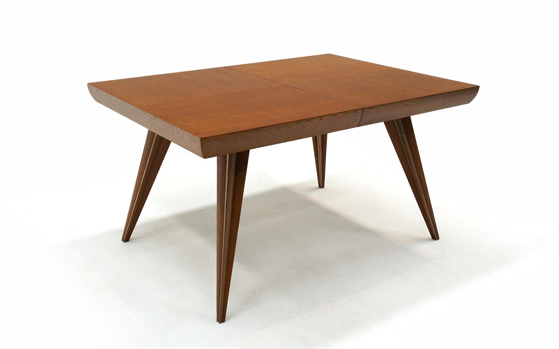 One of a kind custom ordered dining table designed by Vladimir Kagan for Kagan-Dreyfuss, late 1940s.  Patterned Oak top with classic Kagan sculptural legs.  Starts at 54 inches in length.  Two leaves, each being 18 inches make the table 90 inches