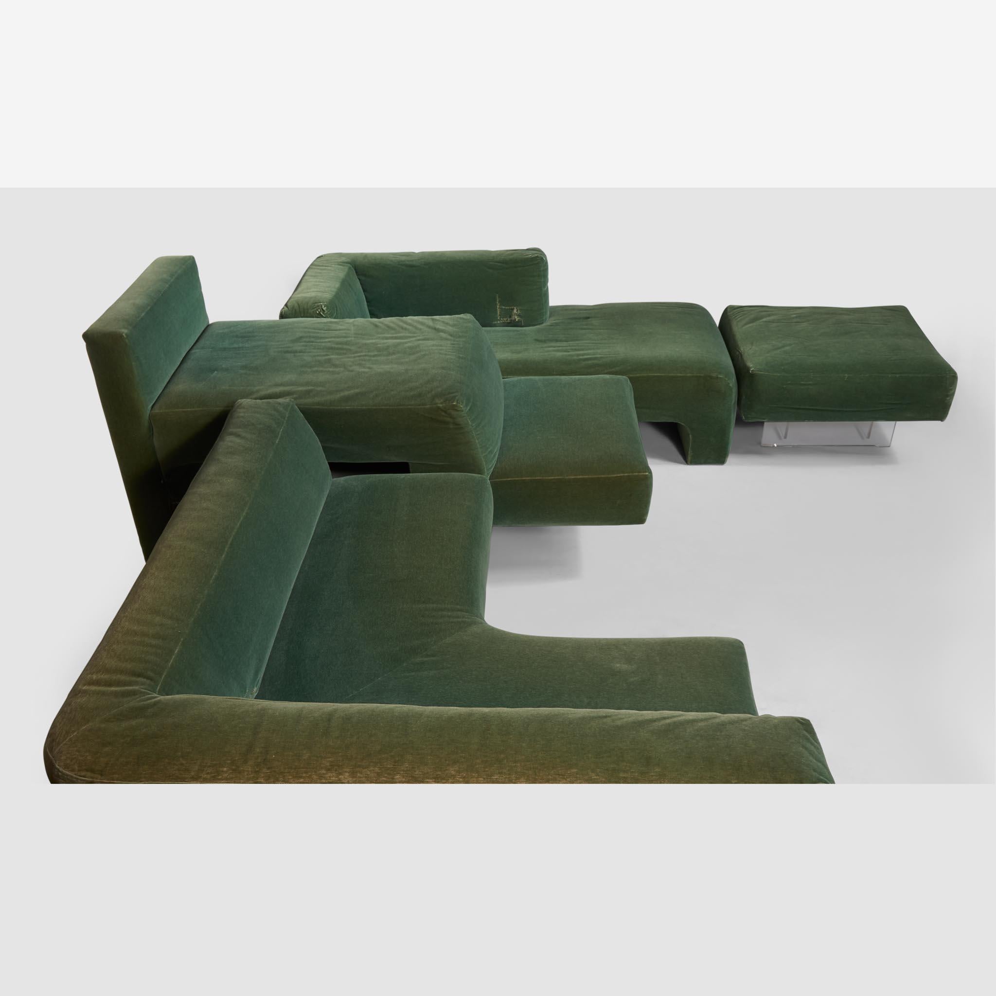 This may be the first Omnibus seating installation ever created by Kagan and was installed in the living room of Vladimir Kagan and Erica Wilson's Park Avenue apartment. With original green velvet upholstery and acrylic legs. In four sections,