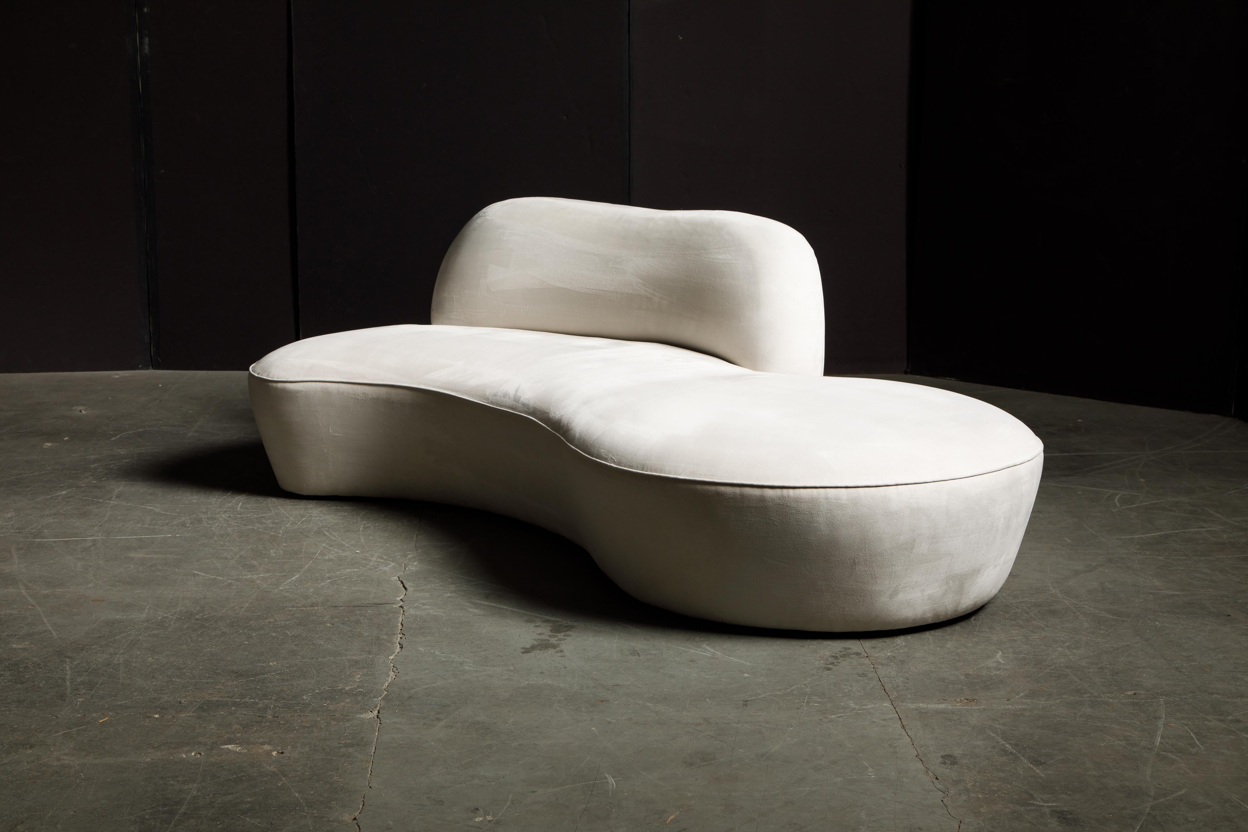 This spectacular example of Vladimir Kagan design was produced by American Leather for a short time, circa early 2000's, in its original white Alcantara Ultrasuede, signed underneath with original American Leather label. Modeled after the early