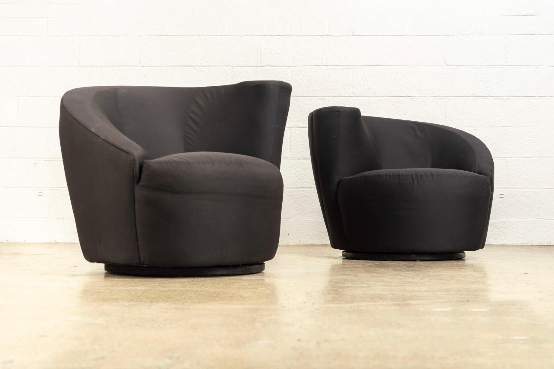 This pair of vintage Mid-Century Modern “Nautilus” club lounge chairs designed by Vladimir Kagan for Directional are circa 1970. The iconic design features classic Kagan style with distinctive curves and elegant organic lines. Upholstered in a black