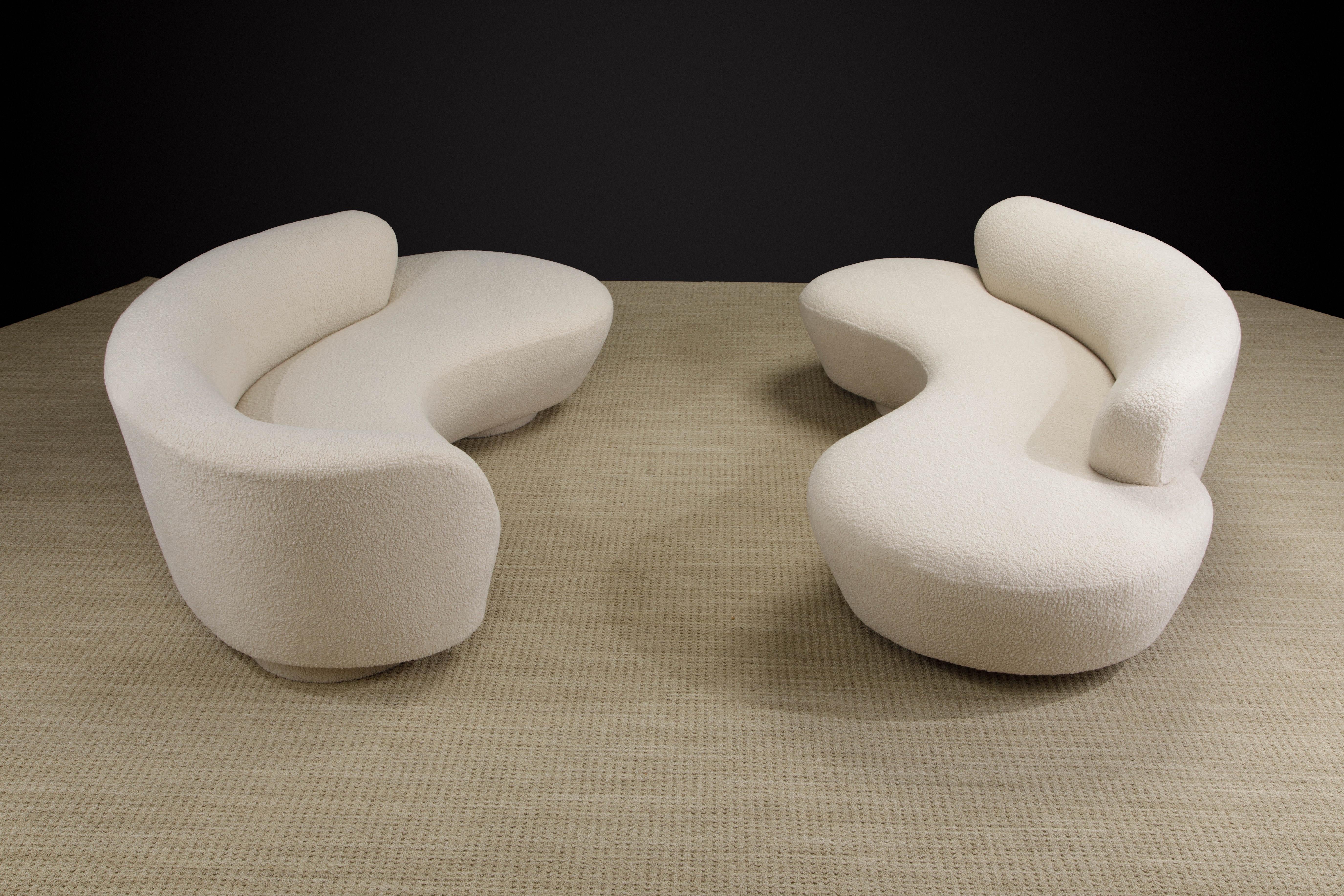 This spectacular pair of Vladimir Kagan 'Cloud' sofas were produced by Directional in circa 1980 and were newly reupholstered in a gorgeous nubby bouclé fabric, both sofas signed underneath with Directional labels and have lucite center support