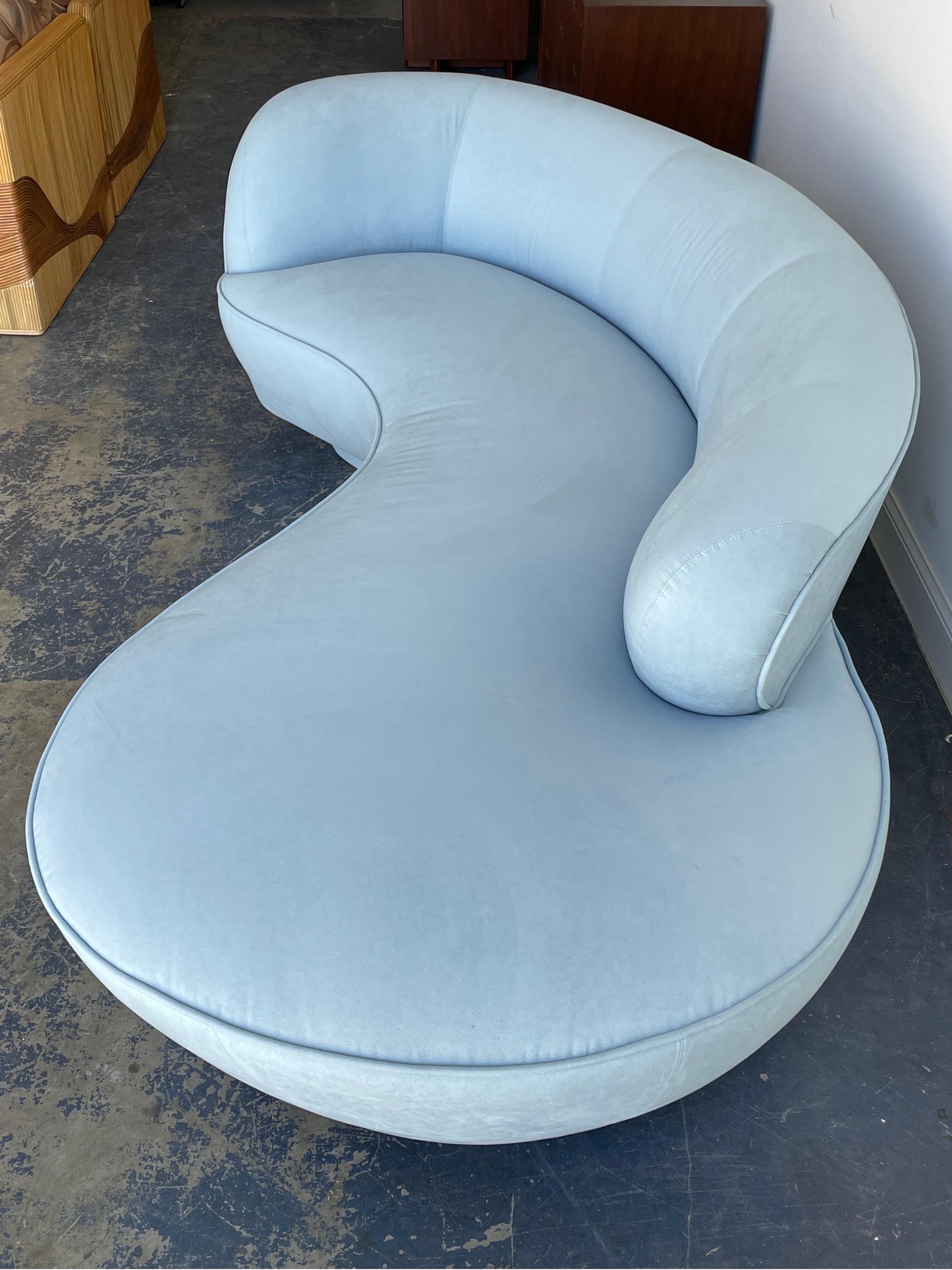 A classic sofa designed by Vladimir Kagan for Directional. Features a soft blue microsuede upholstery, above two round pedestal bases and a lucite center support. Great organic design in an uncommon color. 

Sofa was custom ordered in this color
