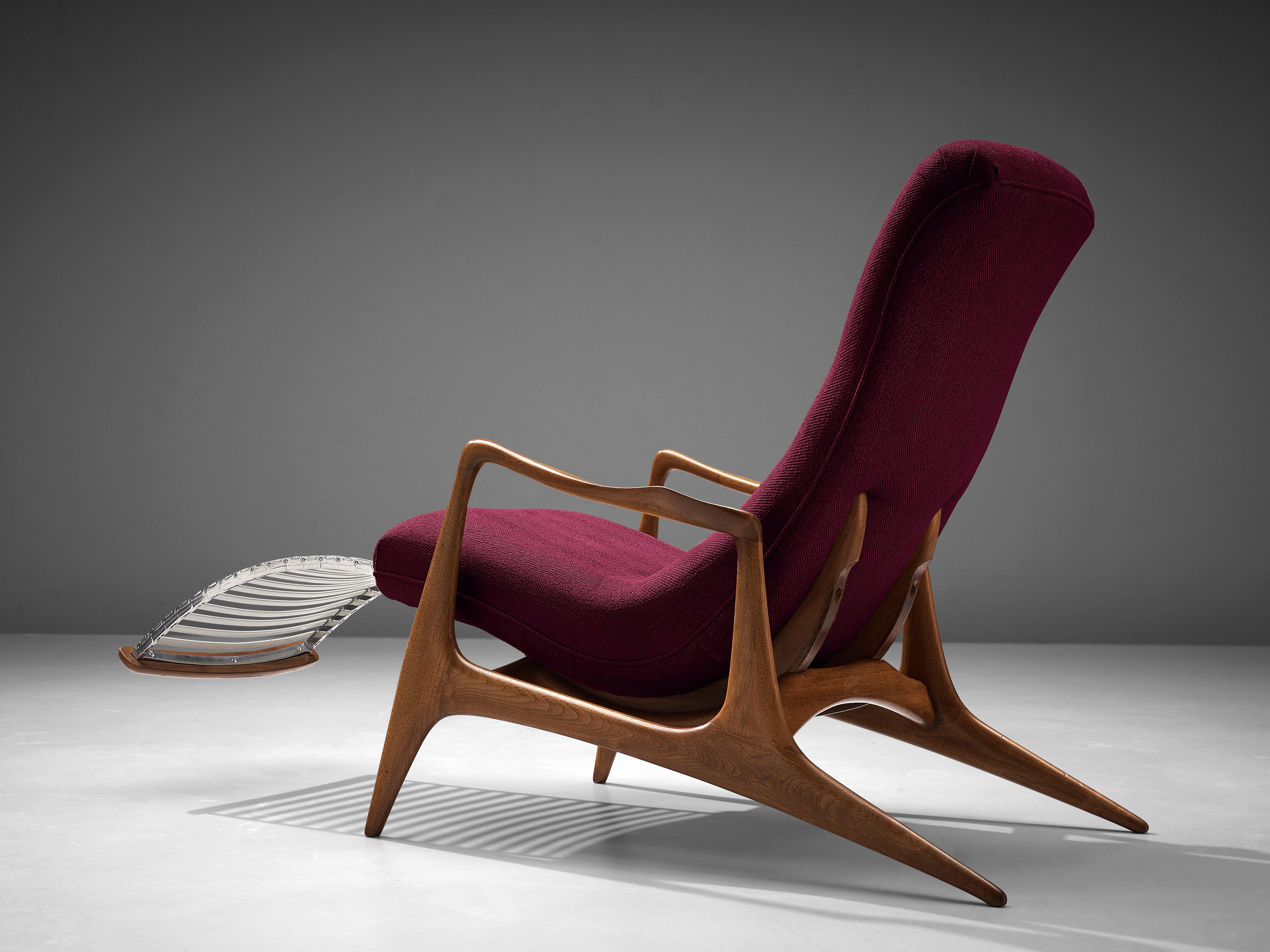 Vladimir Kagan for Dreyfuss, 'Contour' chair model VK 100, teak, purple fabric, United States, 1950s
 
This lounge chair by Kagan is sculptural and delicate. The frame is executed in teak, carved and detailed in an exquisite manner. The back legs