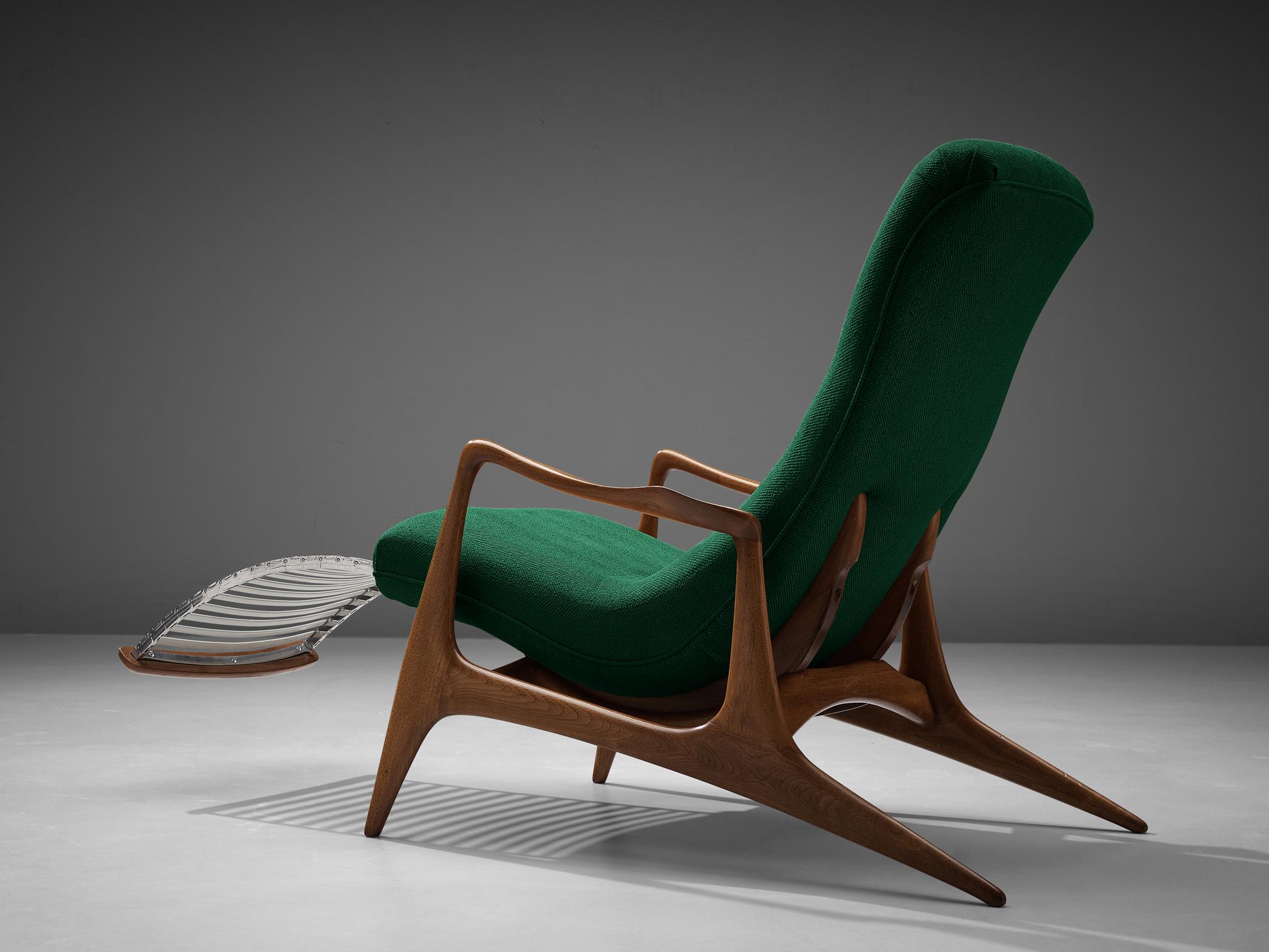 Vladimir Kagan for Dreyfuss, 'Contour' chair model VK 100, teak, green fabric, United States, 1950s
 
This lounge chair by Kagan is sculptural and delicate. The frame is executed in teak, carved and detailed in an exquisite manner. The back legs are