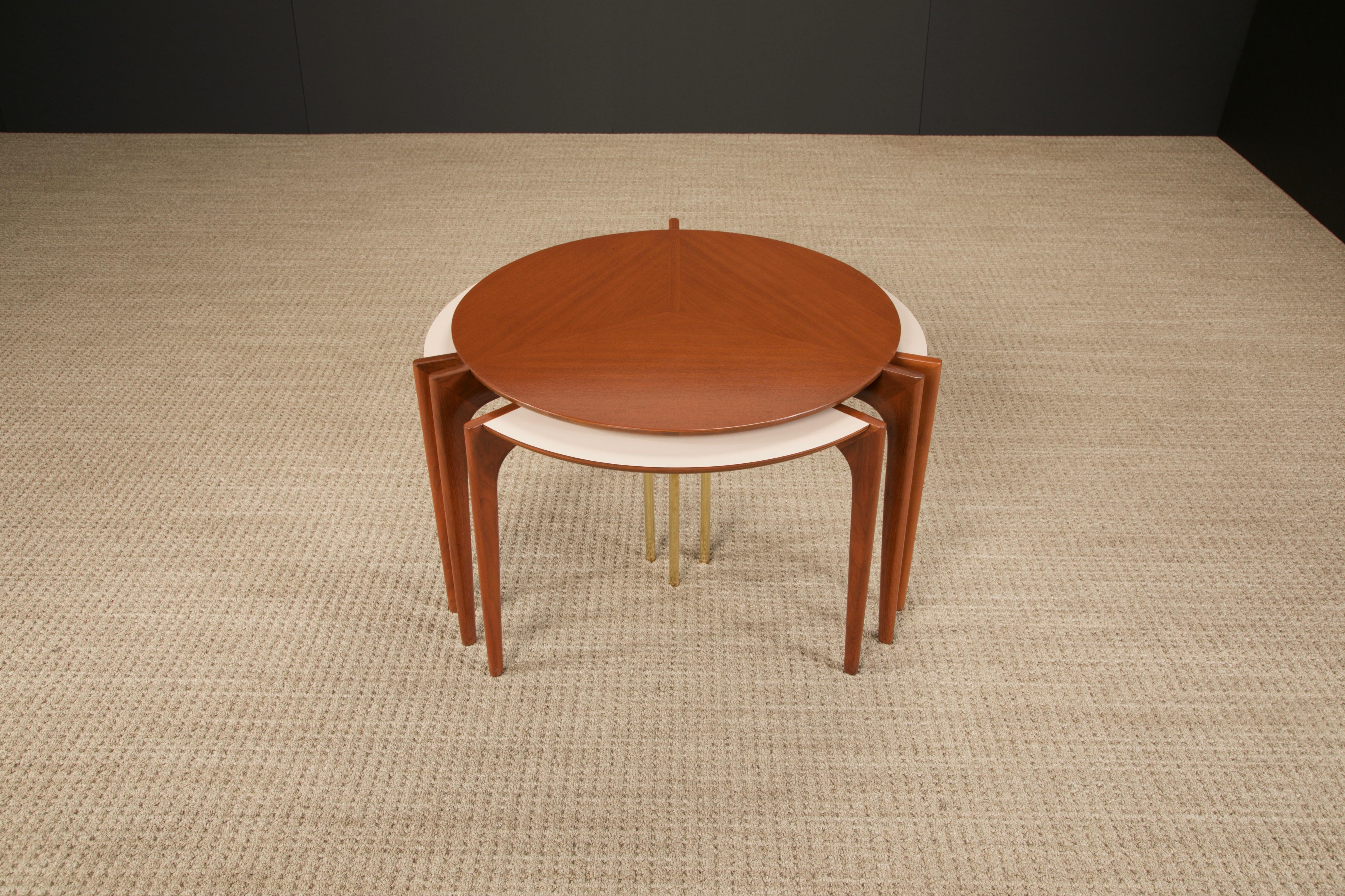 An extremely rare collectors set of nesting tables by Vladimir Kagan for Grosfeld House (1950's USA), fully restored. This set is signed underneath the center table with original Grosfeld House sticker label, and documented in early Grosfeld House