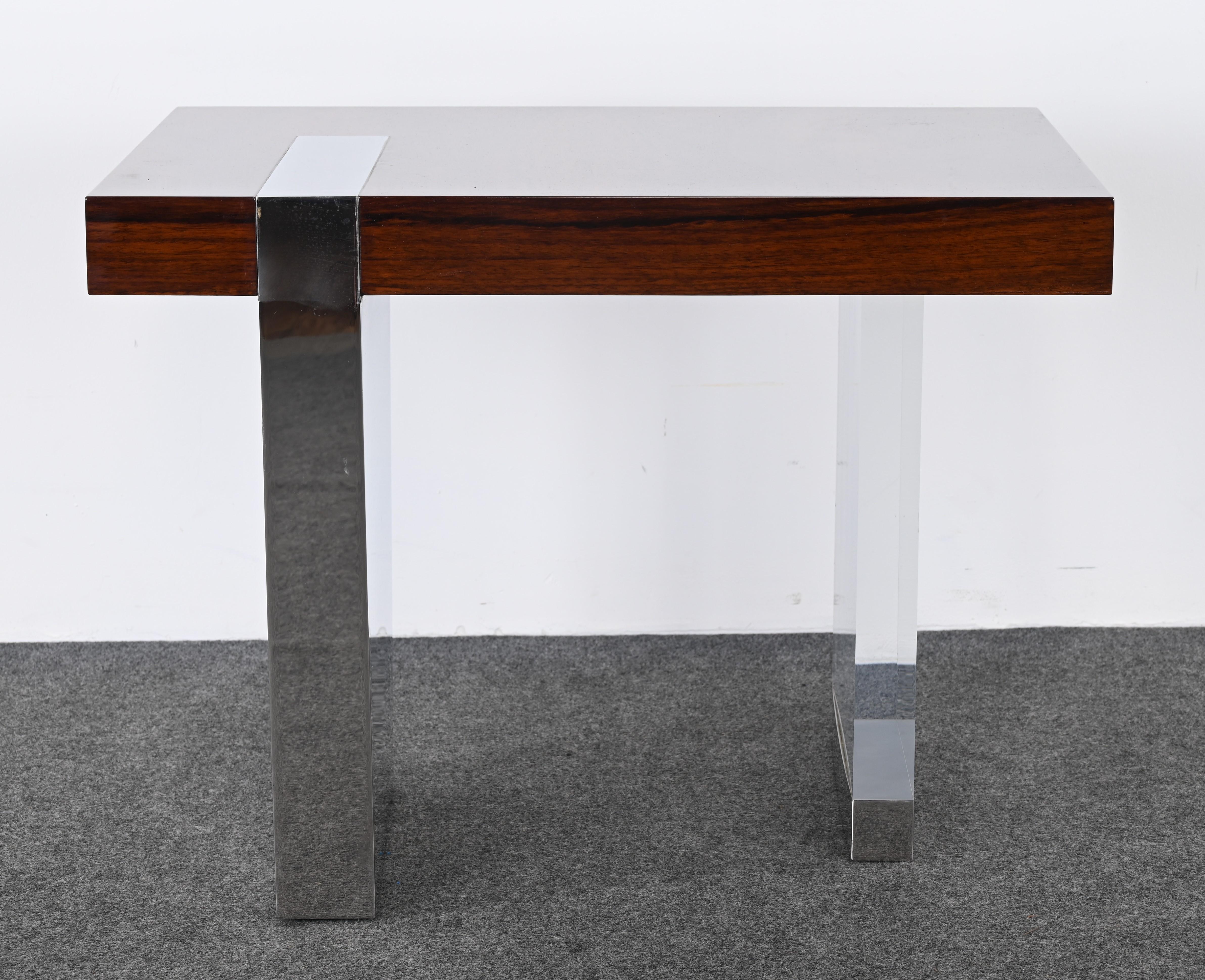 A stunning modernist stainless steel, lucite, and rosewood end table designed by Vladimir Kagan for Gucci, 1990s. This versatile end table would work in any interior, whether a bedroom or living room. The occasional table is part of a collection