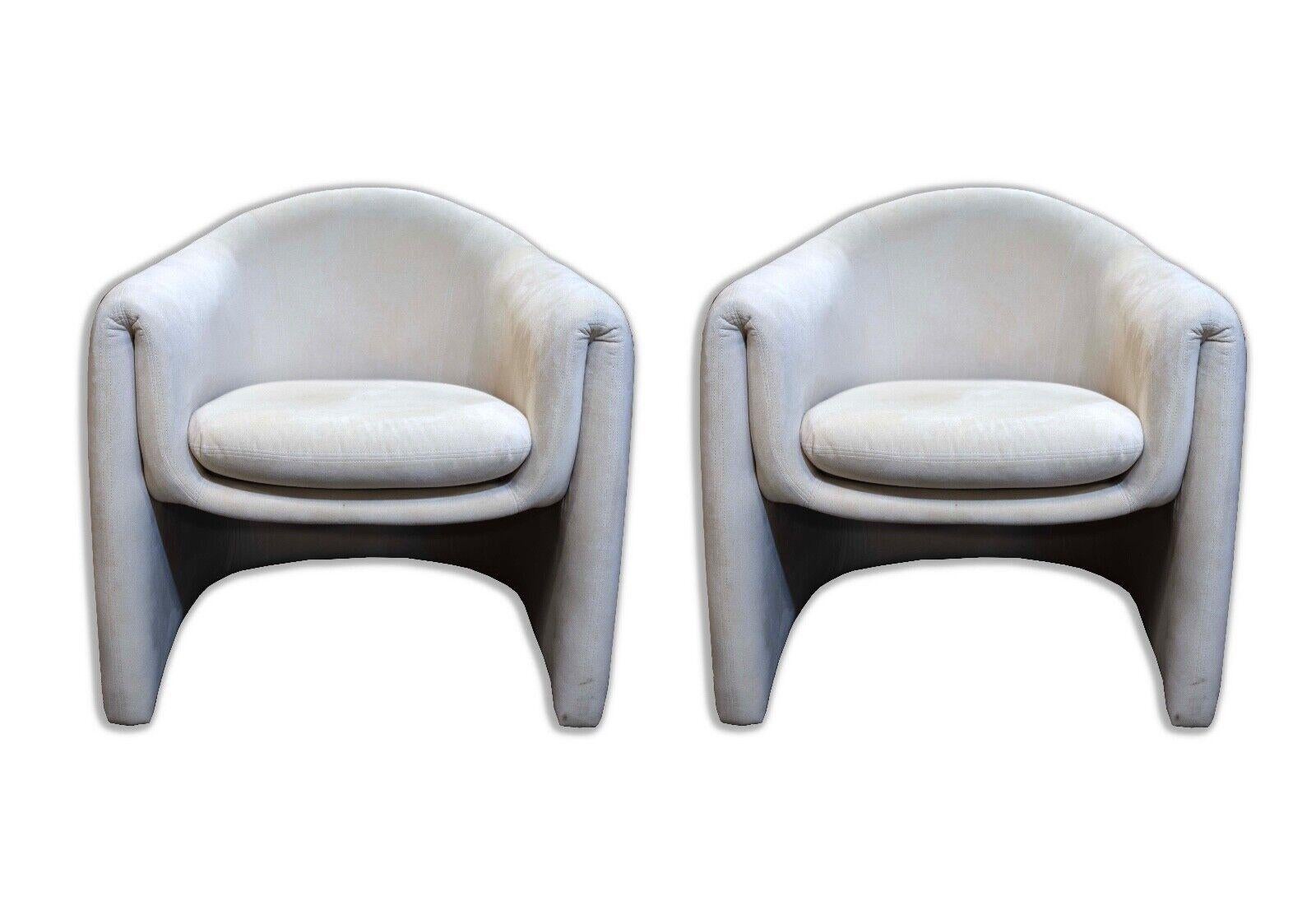 Elegant Vladimir Kagan for Preview chairs from the 1980s, these off-white, mid-century modern pieces exhibit a unique blend of style and comfort. Their curvaceous form is accented by the stark contrast of the dark and light upholstery, creating a