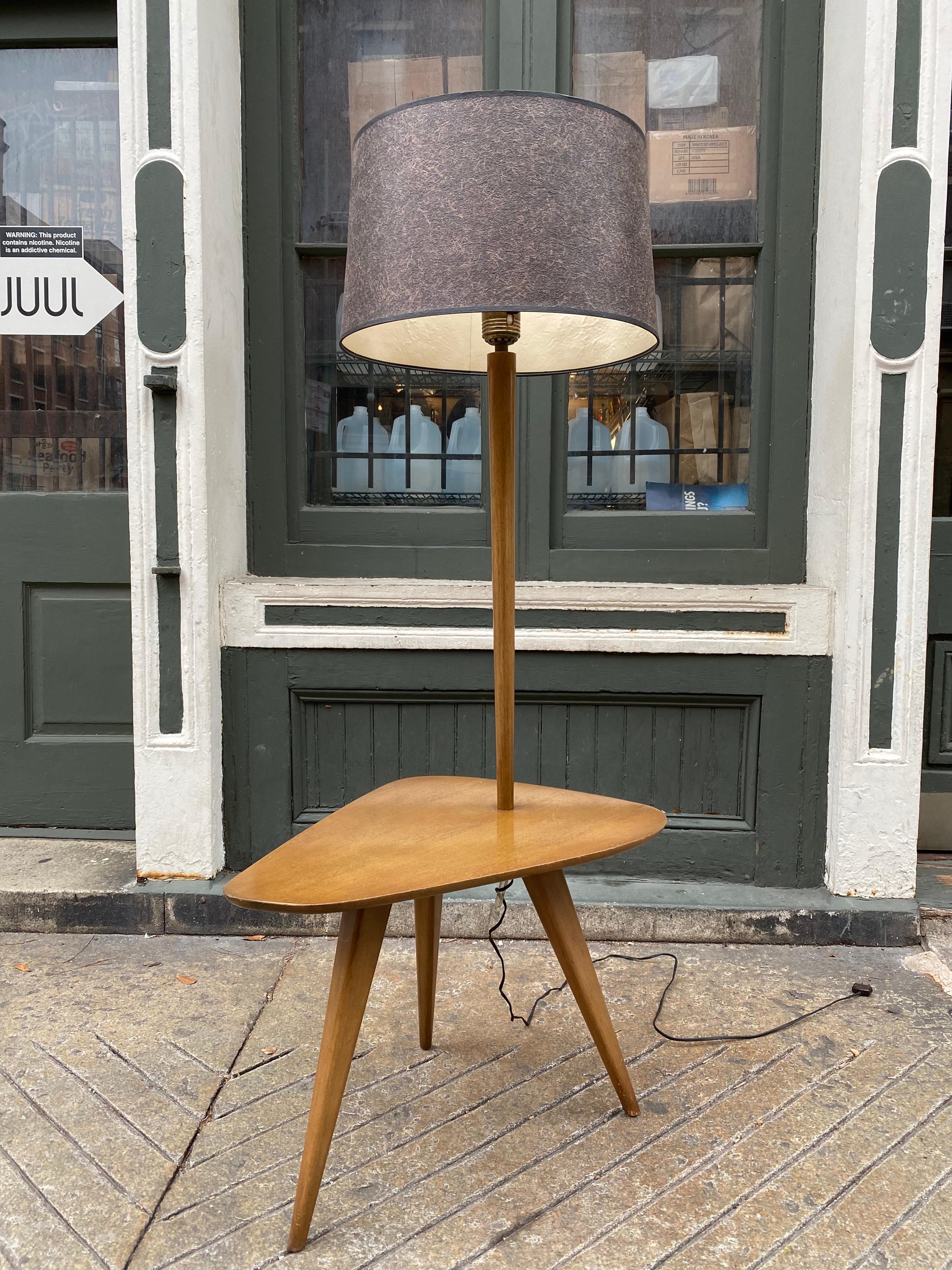 Vladimir Kagan lamp table designed by Kagan/Dreyfuss for a NYC upper east side apartment in 1954. Stamped on underside. Rear leg is slotted for electrical cord to run down leg without being seen. Original finish presents very well.