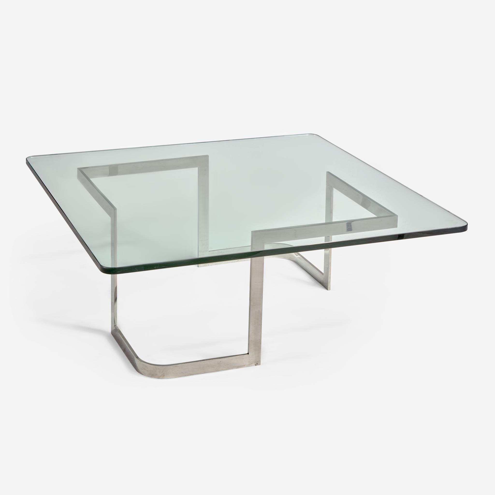 Originally installed in the living room of Vladimir Kagan and Erica Wilson's Park Avenue apartment. A true post modern piece constructed of polished stainless steel with a tempered glass top. Designed as a square glass top with a curved and straight