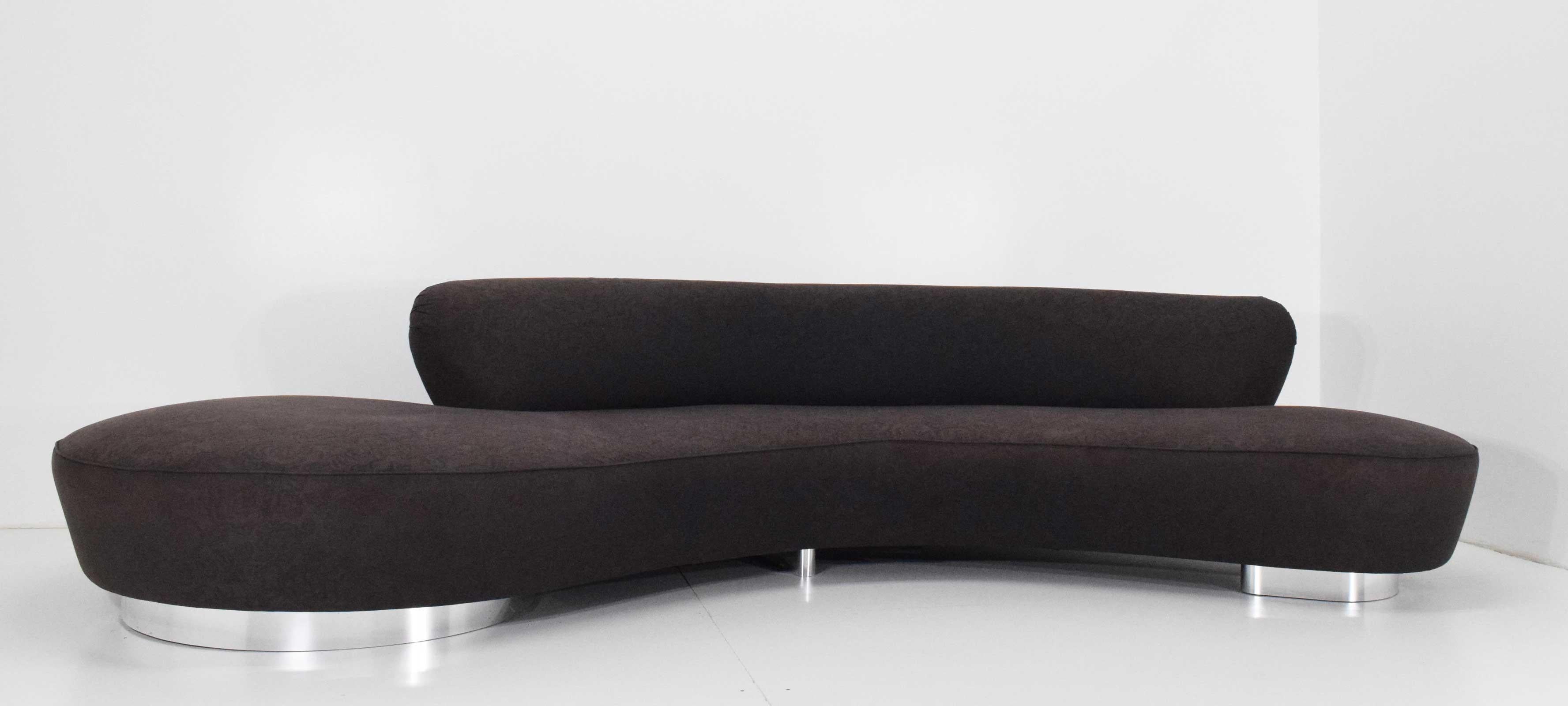 Extra long serpentine sofa by Vladimir Kagan. Chrome bases, ink blue upholstery that can be removed for cleaning as attached via velcro. Sofa can also be reupholstered in fabric of choice. The sofa was designed by Vladimir Kagan in 1950 and has been