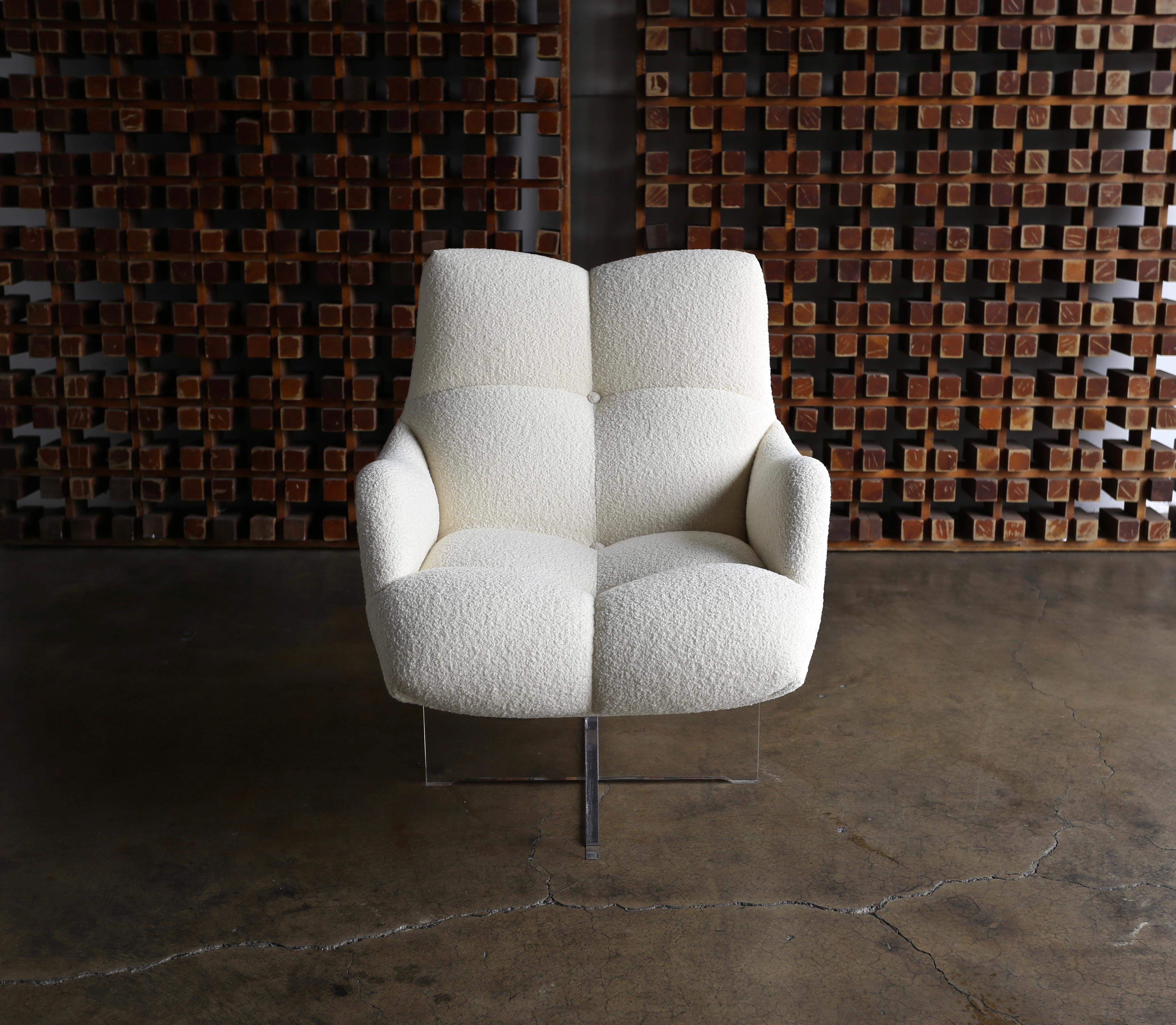 Vladimir Kagan Lucite and bouclé swivel lounge chair, circa 1970. This piece has been expertly restored in Holly Hunt bouclé upholstery.
