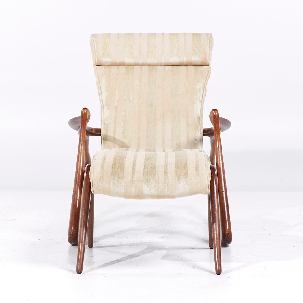 Vladimir Kagan Mid Century Two Position Contour Walnut Rocking Chair and Ottoman

The chair measures: 31.25 wide x 43 deep x 37.25 high, with a seat height of 16 inches and arm height/chair clearance of 23.25 inches
The ottoman measures: 20.75 wide
