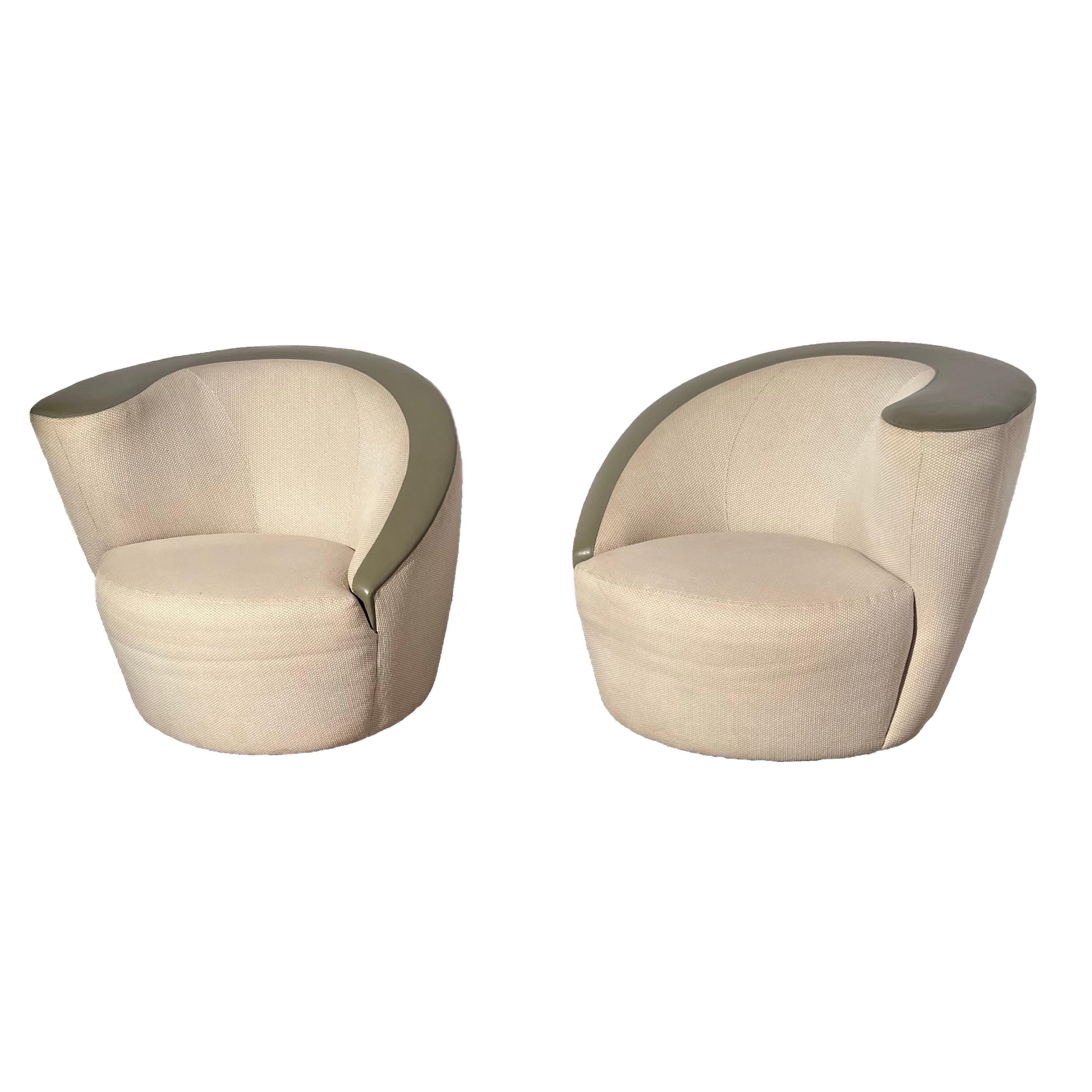 For your consideration we are offering these  Iconic chairs in the original leather and fabric combination upholstery. These chairs are extremely comfortable and the swivel mechanisms work perfectly.