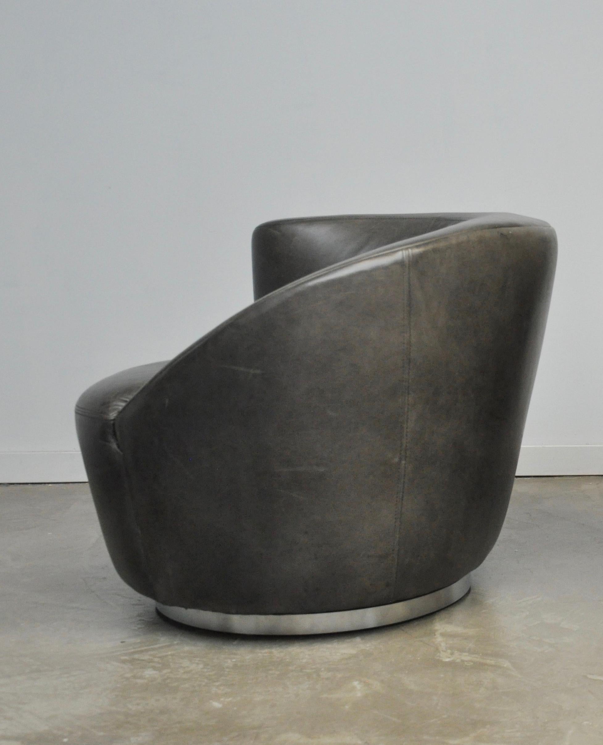 Vladimir Kagan Naultilus swivel chair. Original grey leather with beautiful patina. Chrome base.